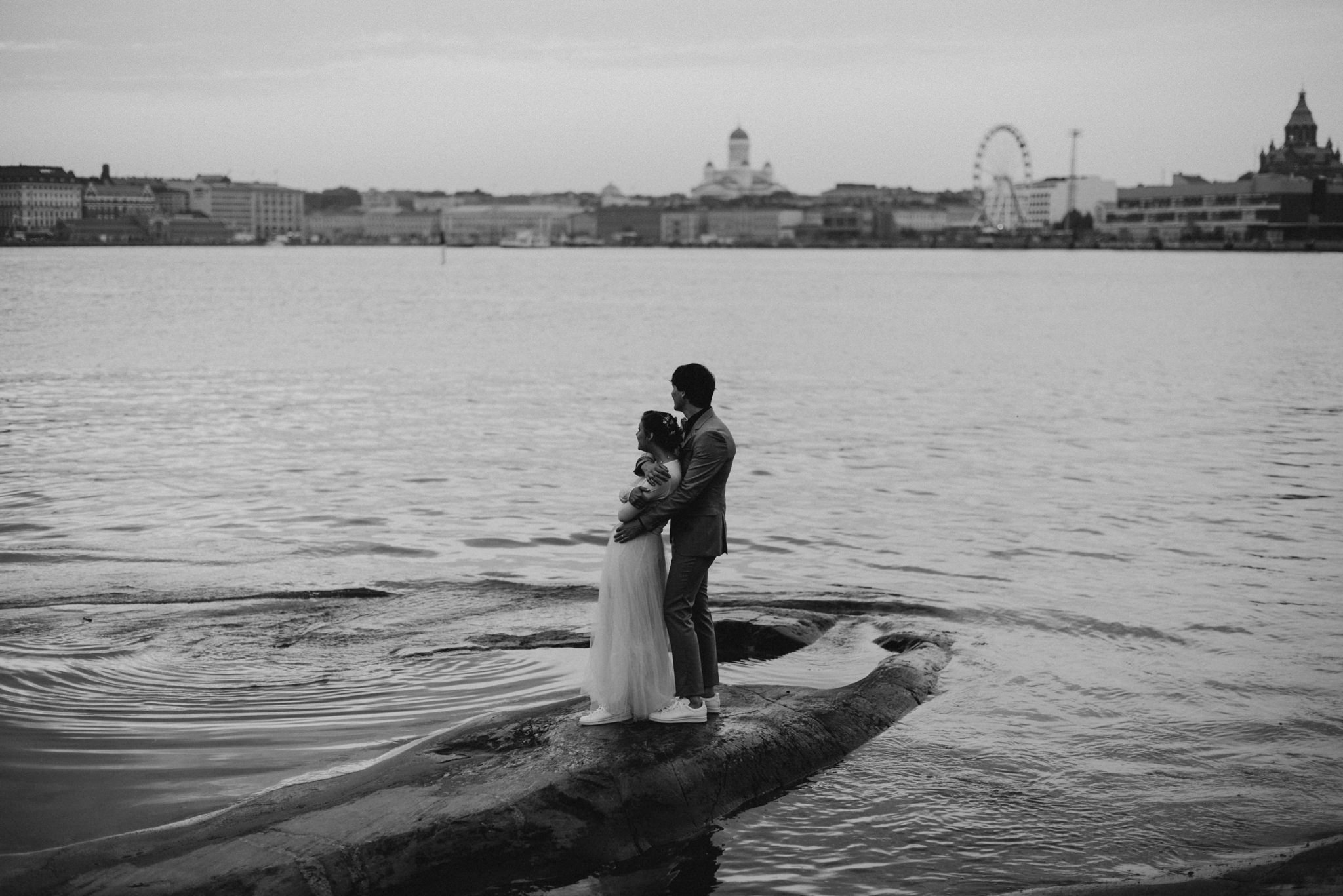 Wedding portraits overlooking Helsinki from Valkosaari at sunset