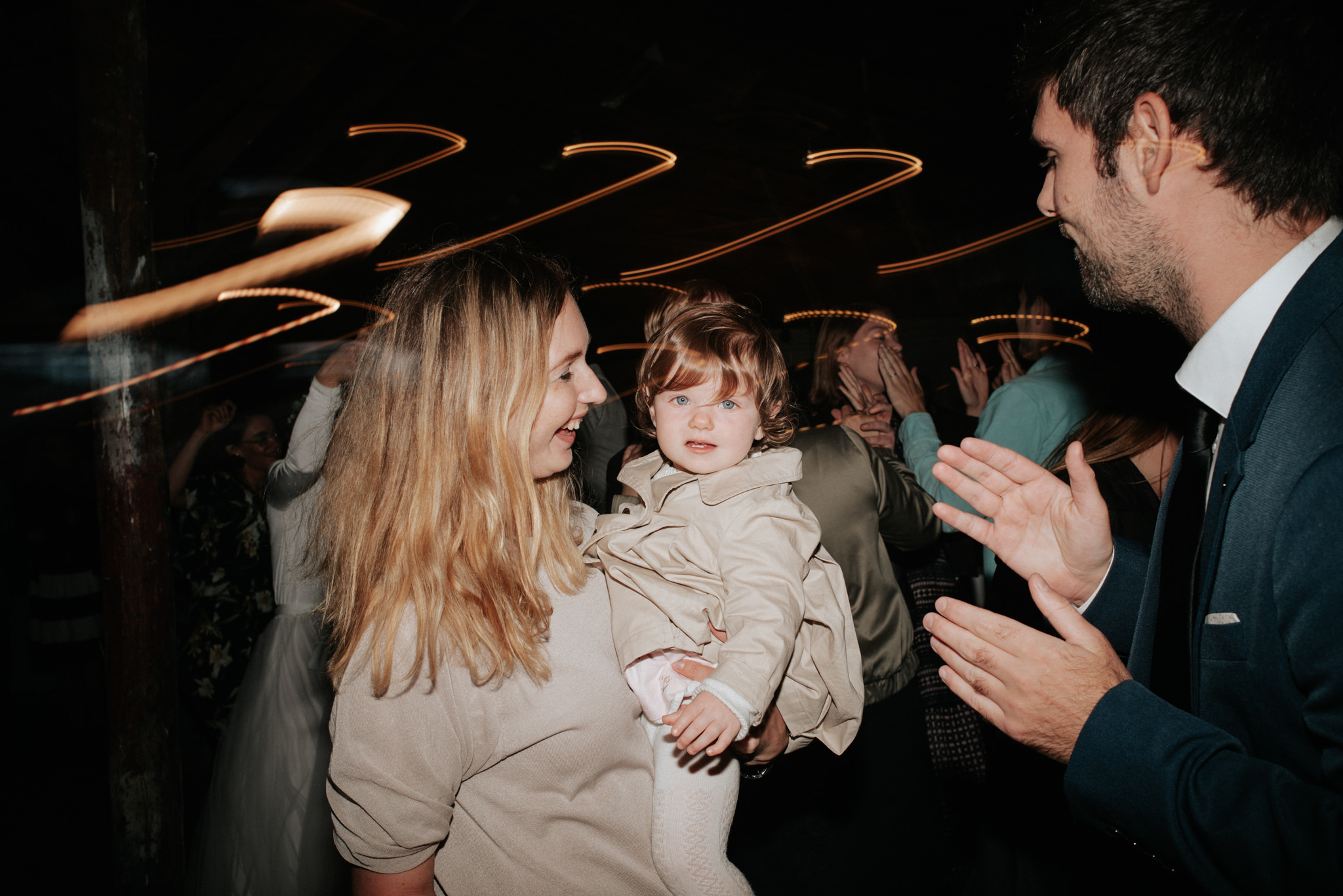 guests with baby dancing during wedding reception