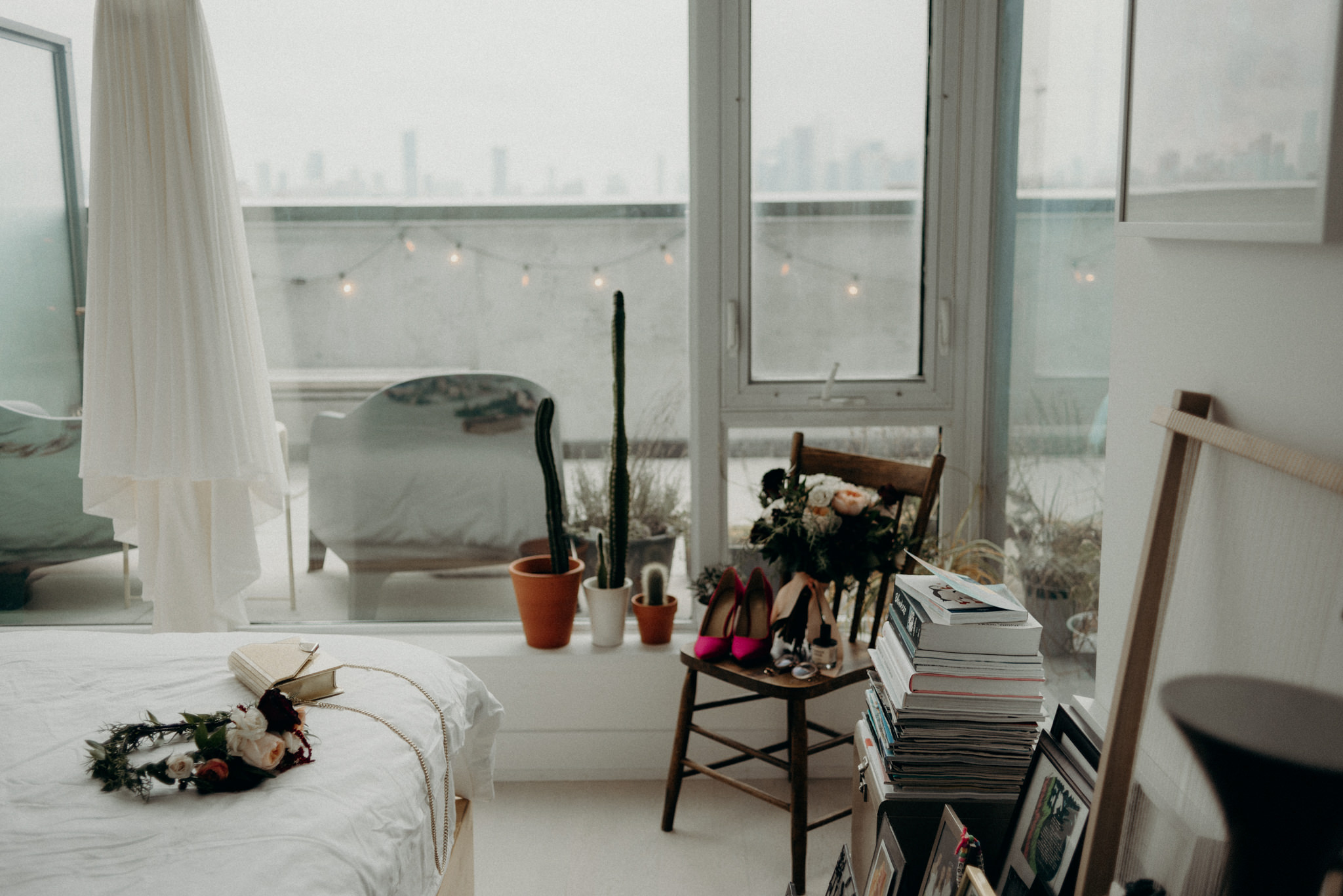 wedding dress and accessories in condo bedroom