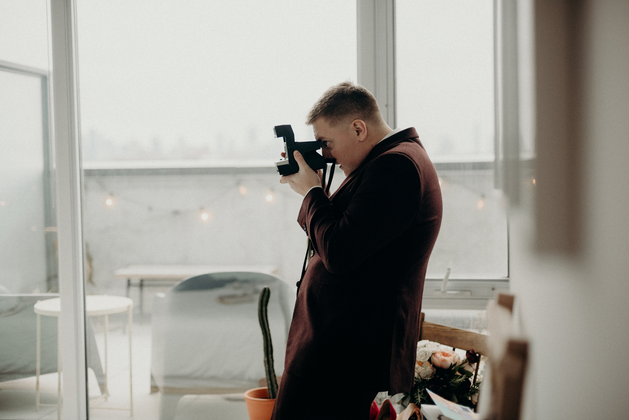 bride holding super 8 camera