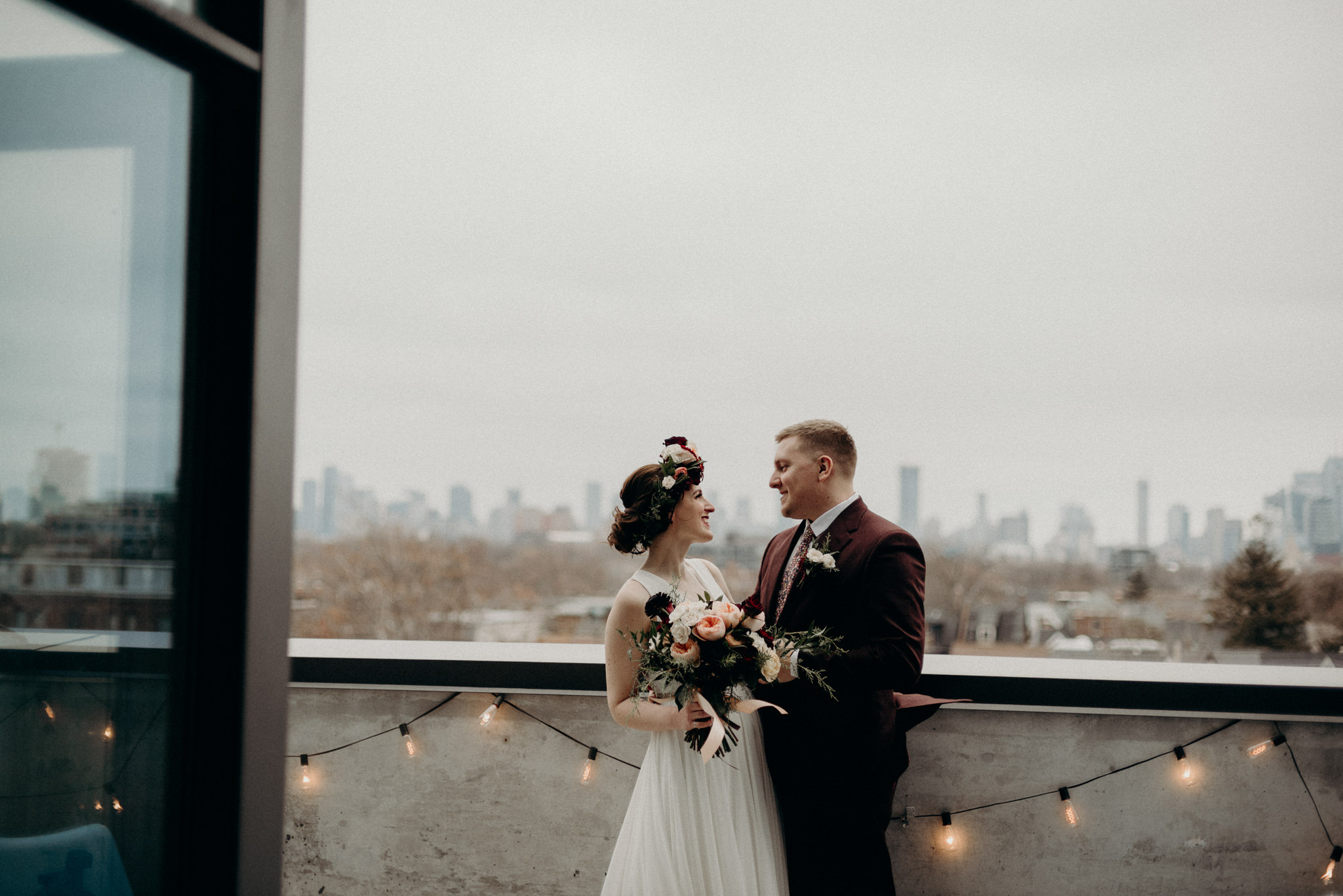 bride sitting on edge of bed