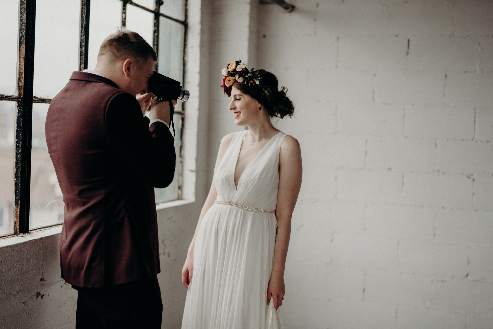 bride in old loft taking super 8 film