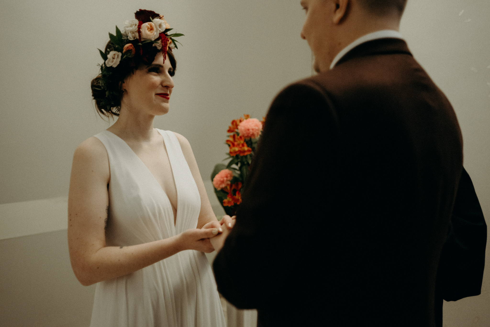 bride holding bouquet standing on street in Toronto