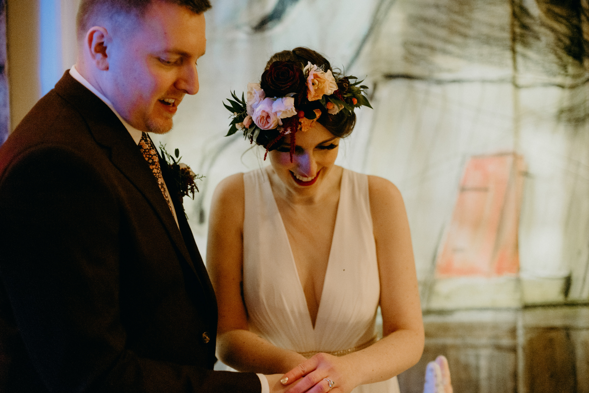 bride and groom cutting cake in restaurant