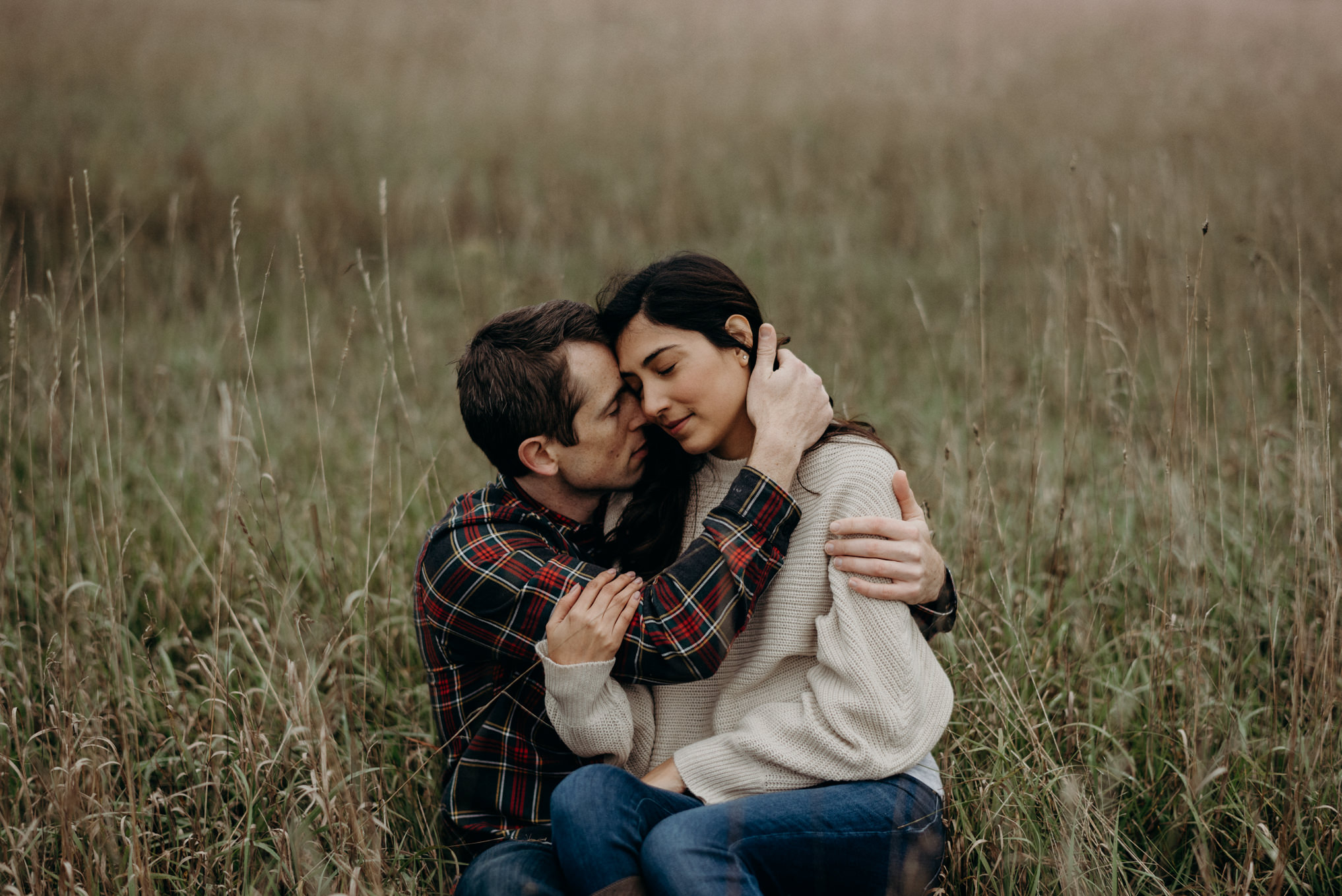 couple laughing in the grass