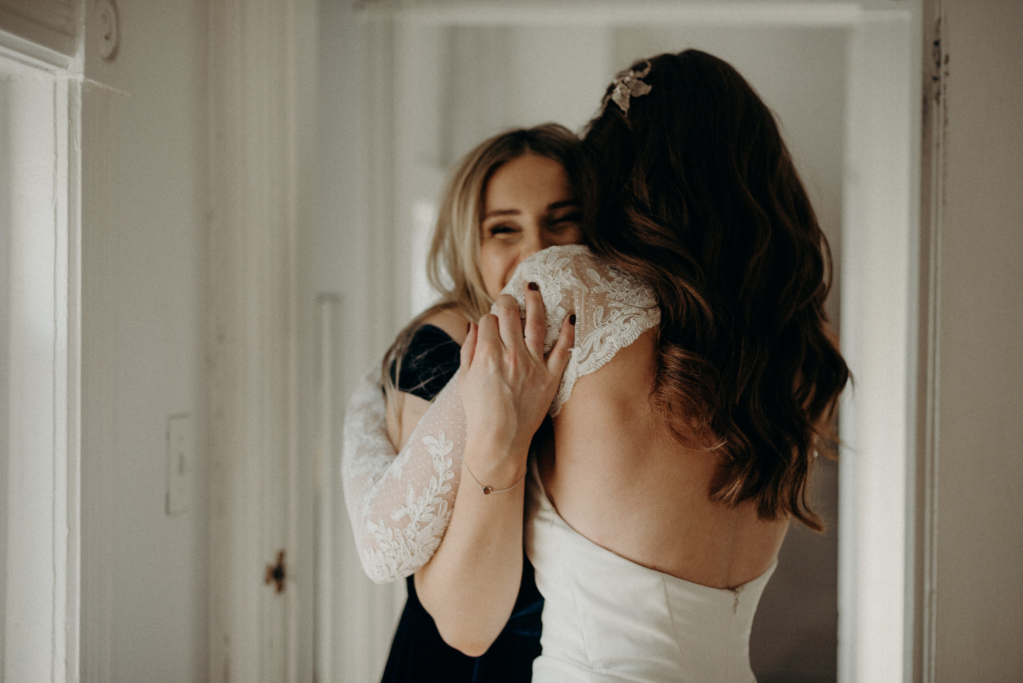 bride getting bridesmaid