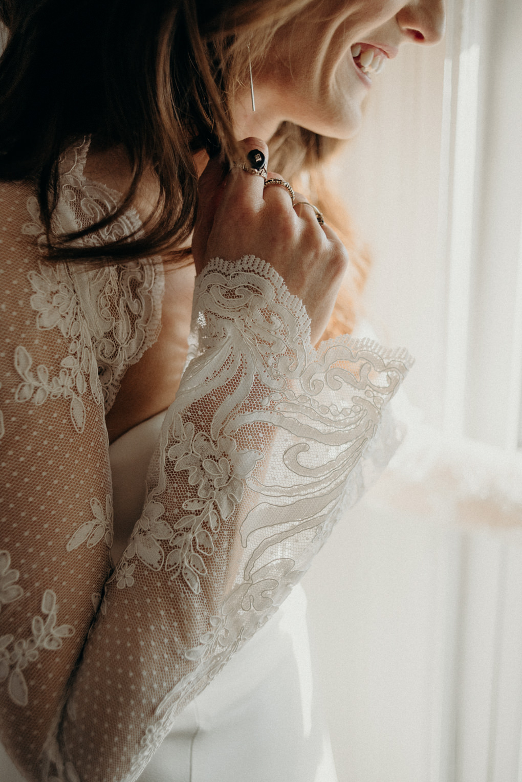 close up of details on long sleeve wedding dress