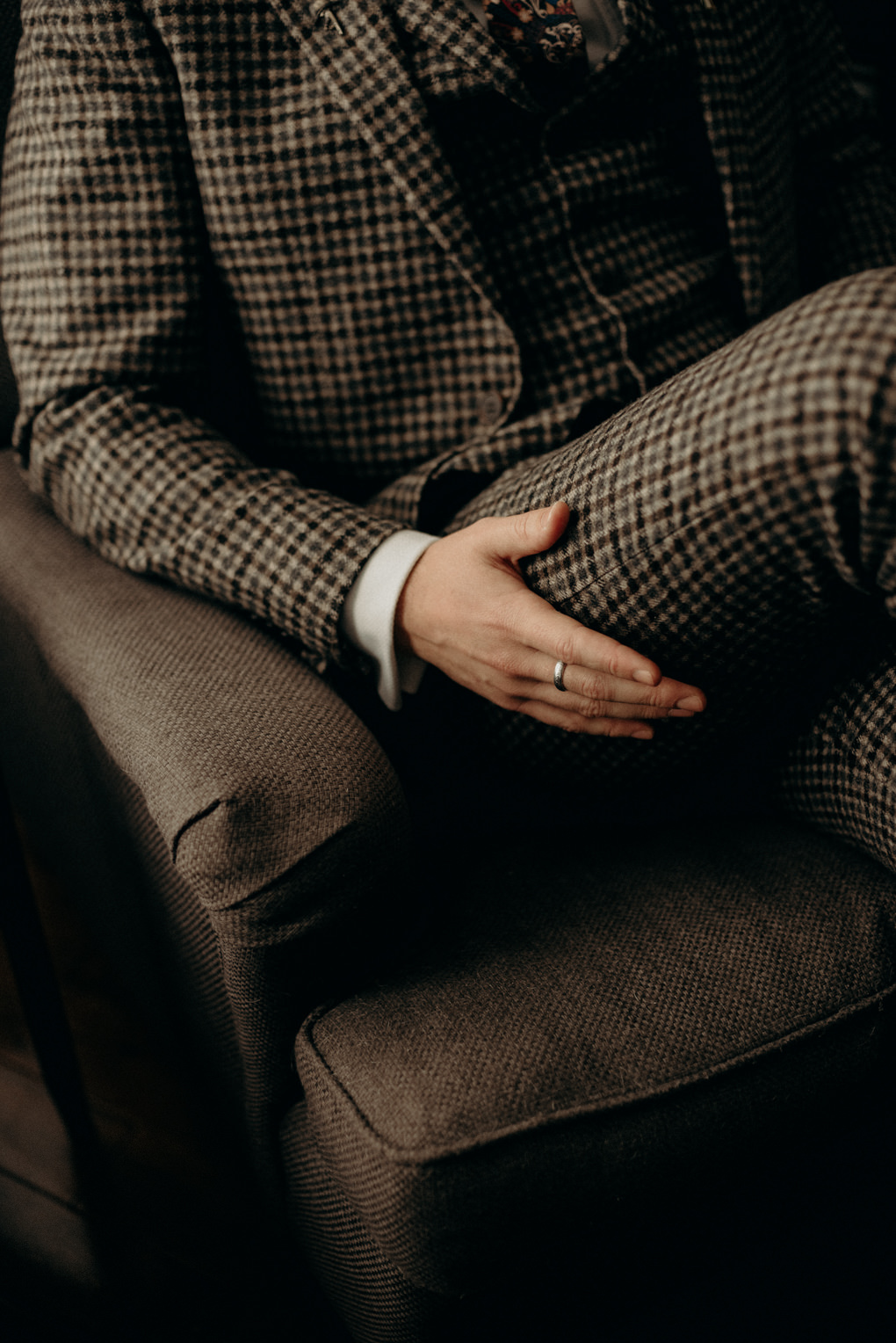 groom sitting in chair