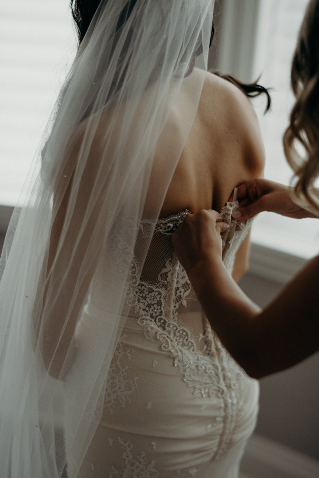 bride getting into dress