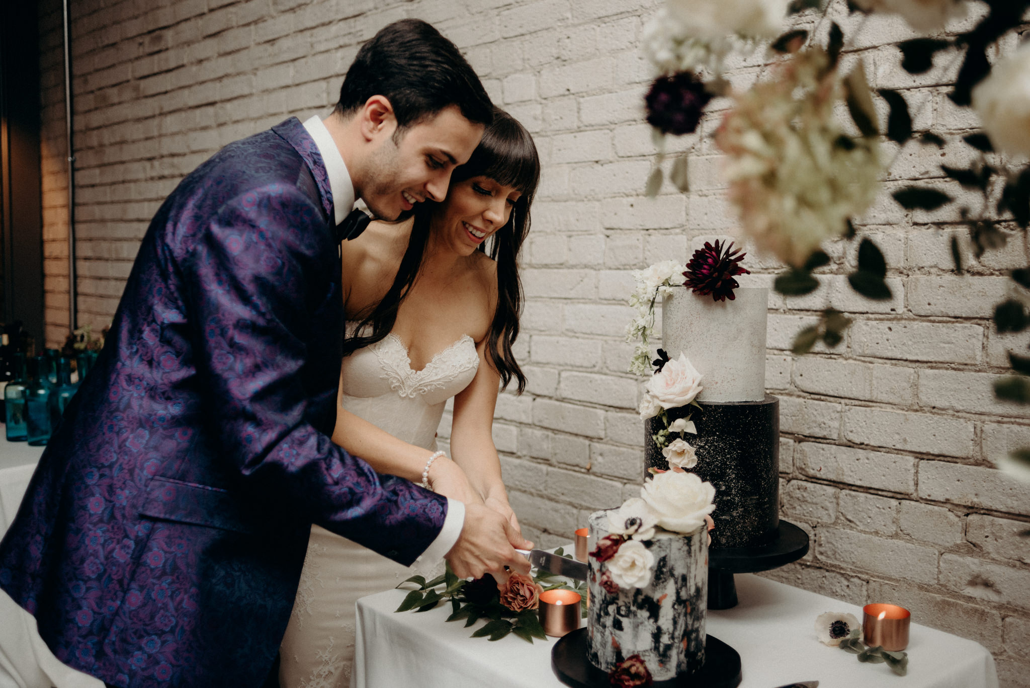 Bride and groom cutting cake