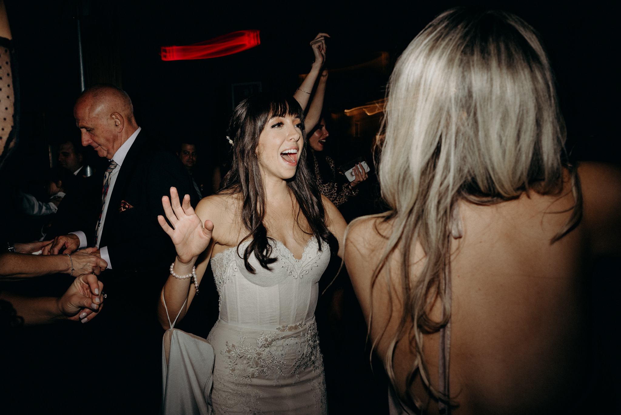 bride singing and dancing during wedding reception