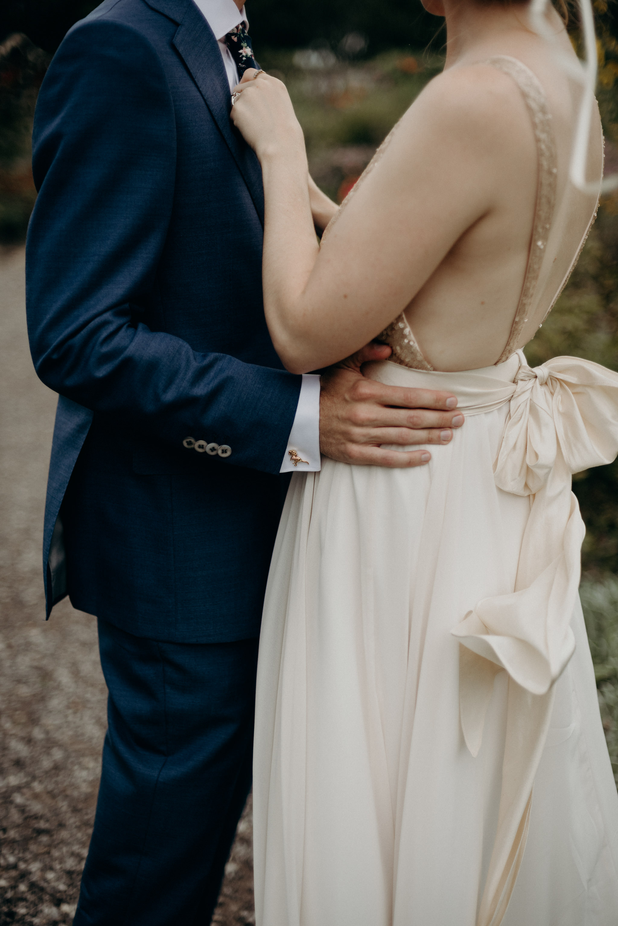 groom holding bride's waist