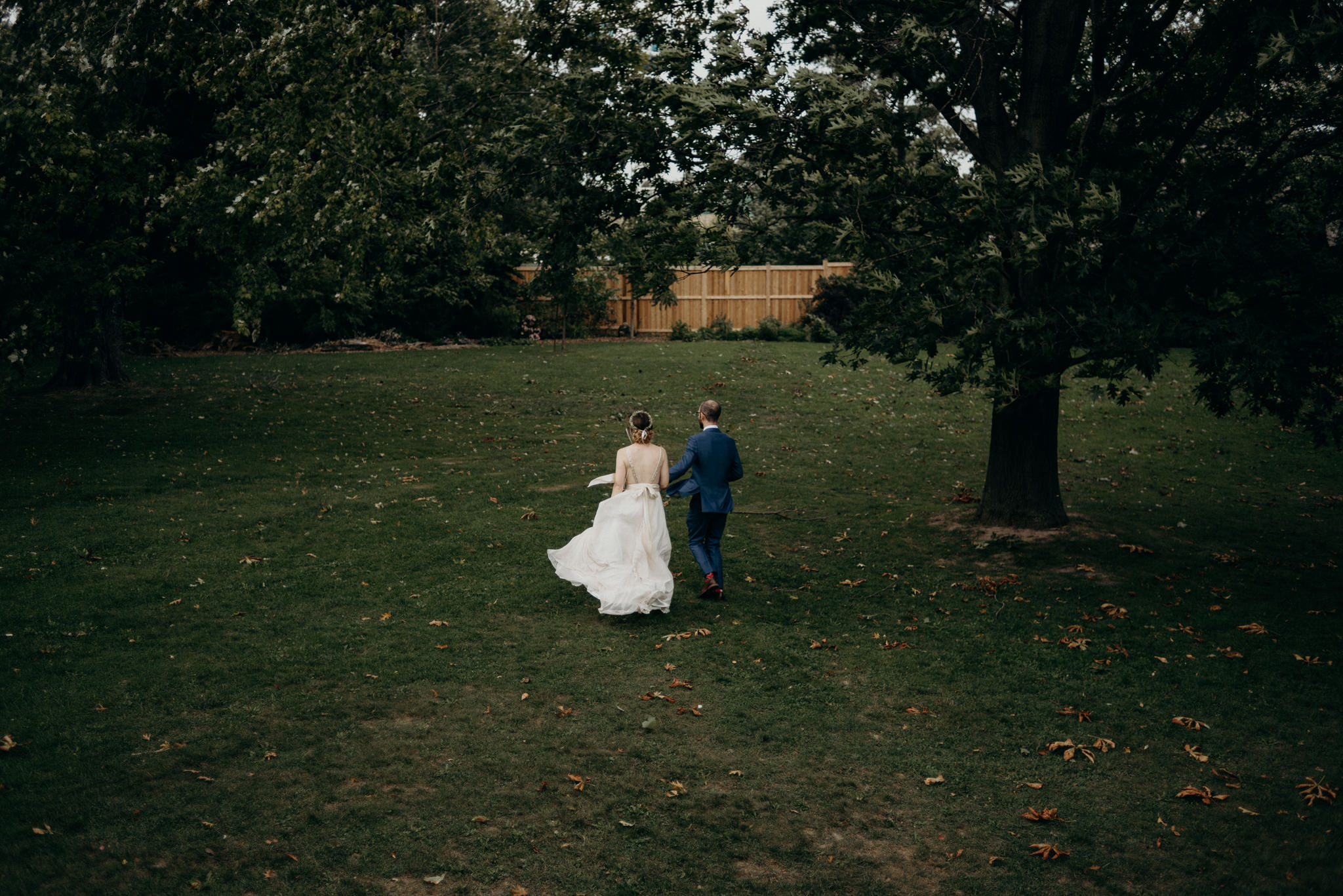 bride and groom walking on property at Spadina Museum