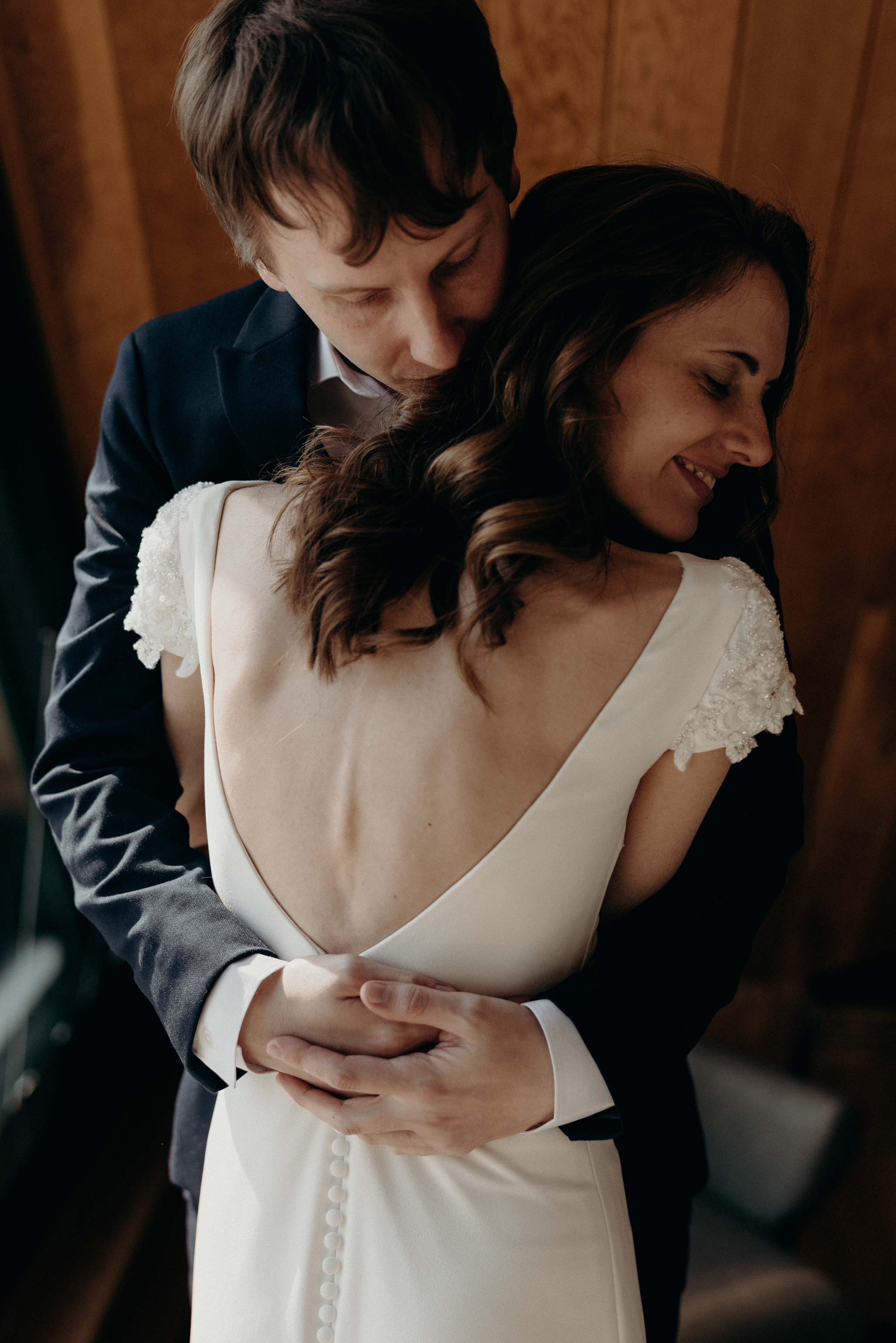 bride and groom hugging