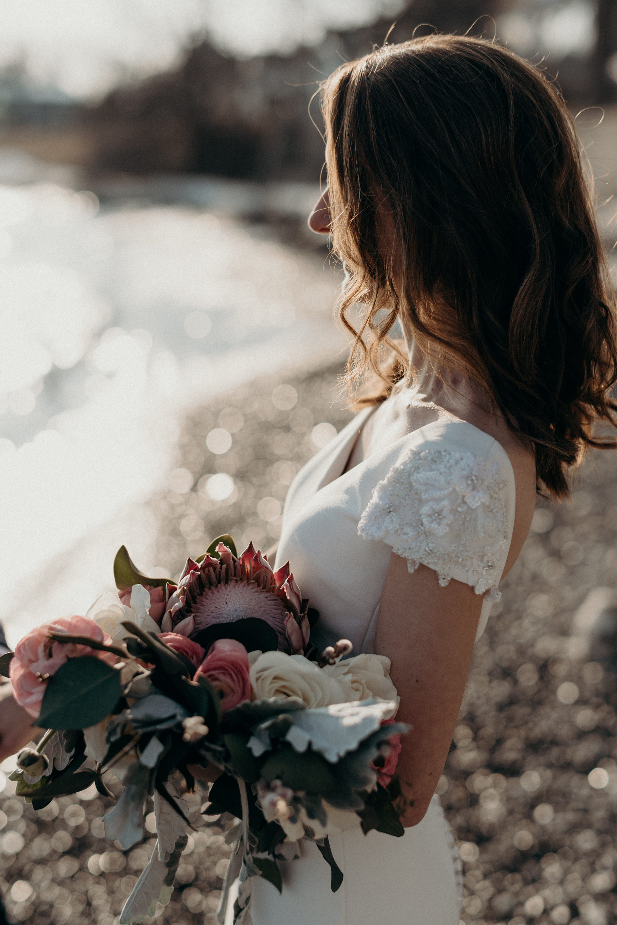 Bride in sunset on the beach in winter