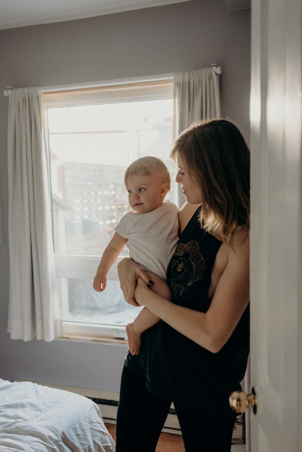 mom carrying toddler boy on hip