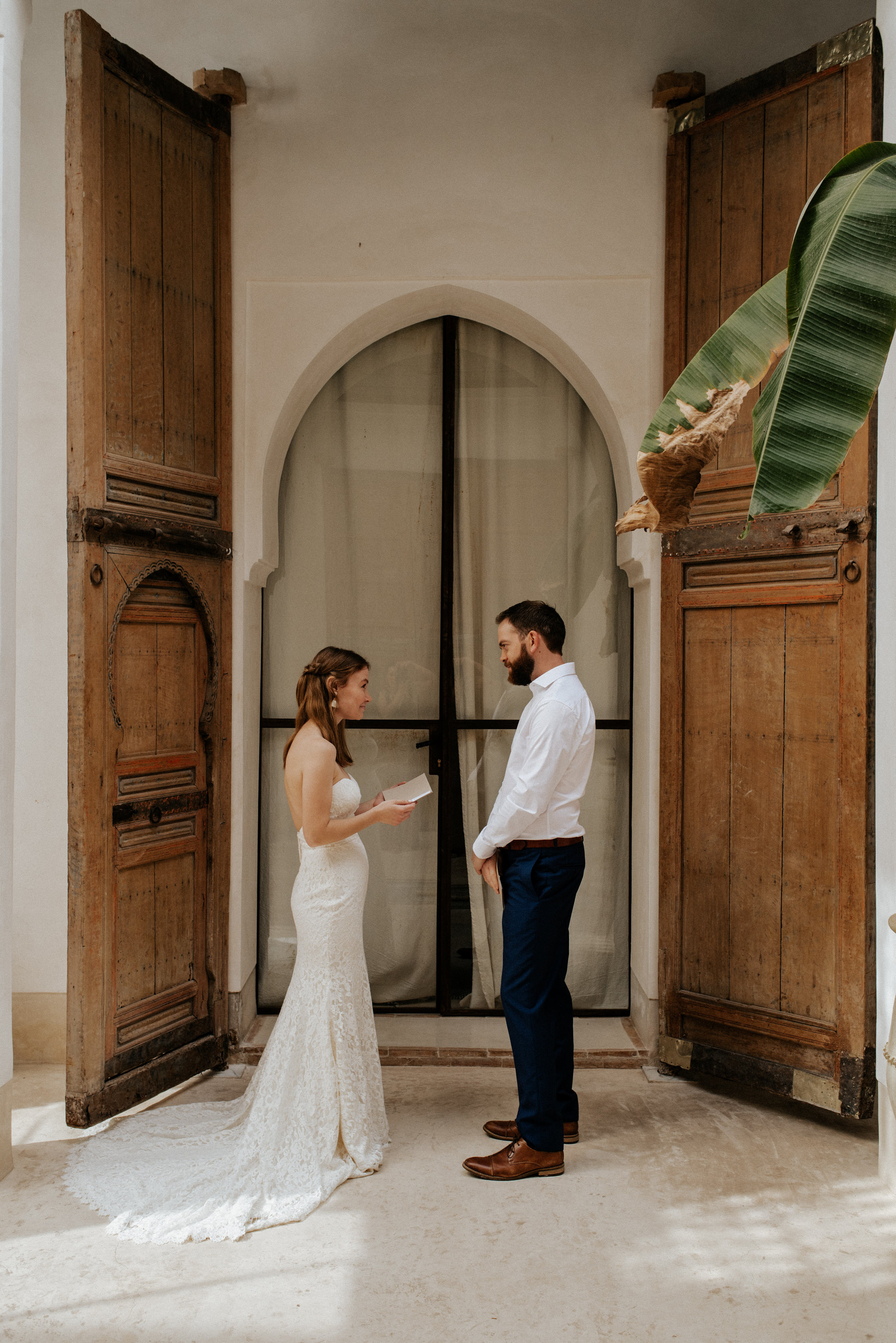 Bride and groom exchanging vows at Morocco elopement at Riad 42