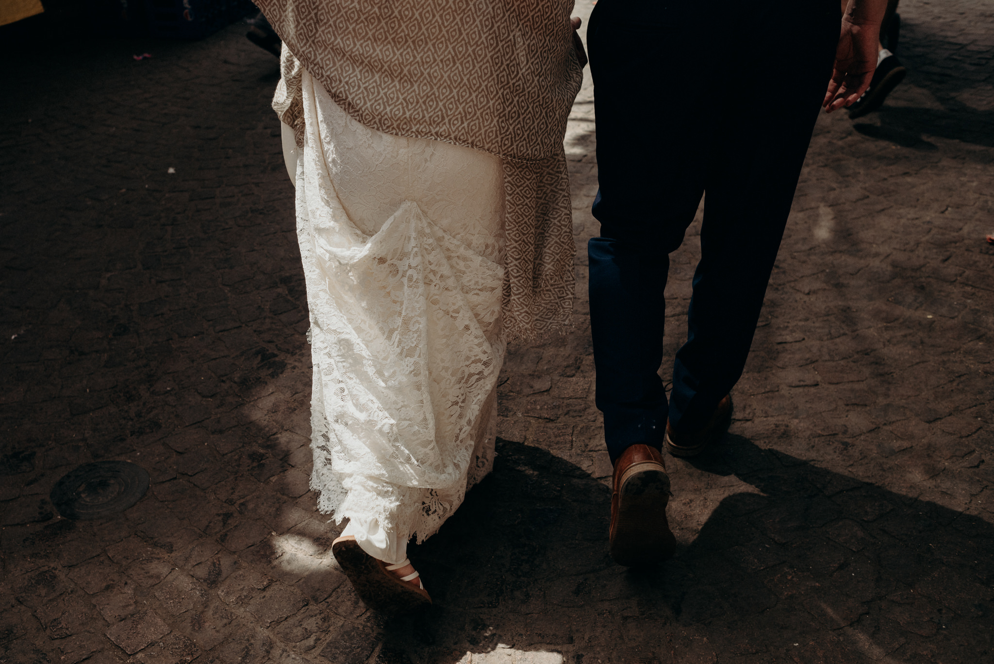 Bride and groom walking in the medina in Marrakech for their Morocco elopement