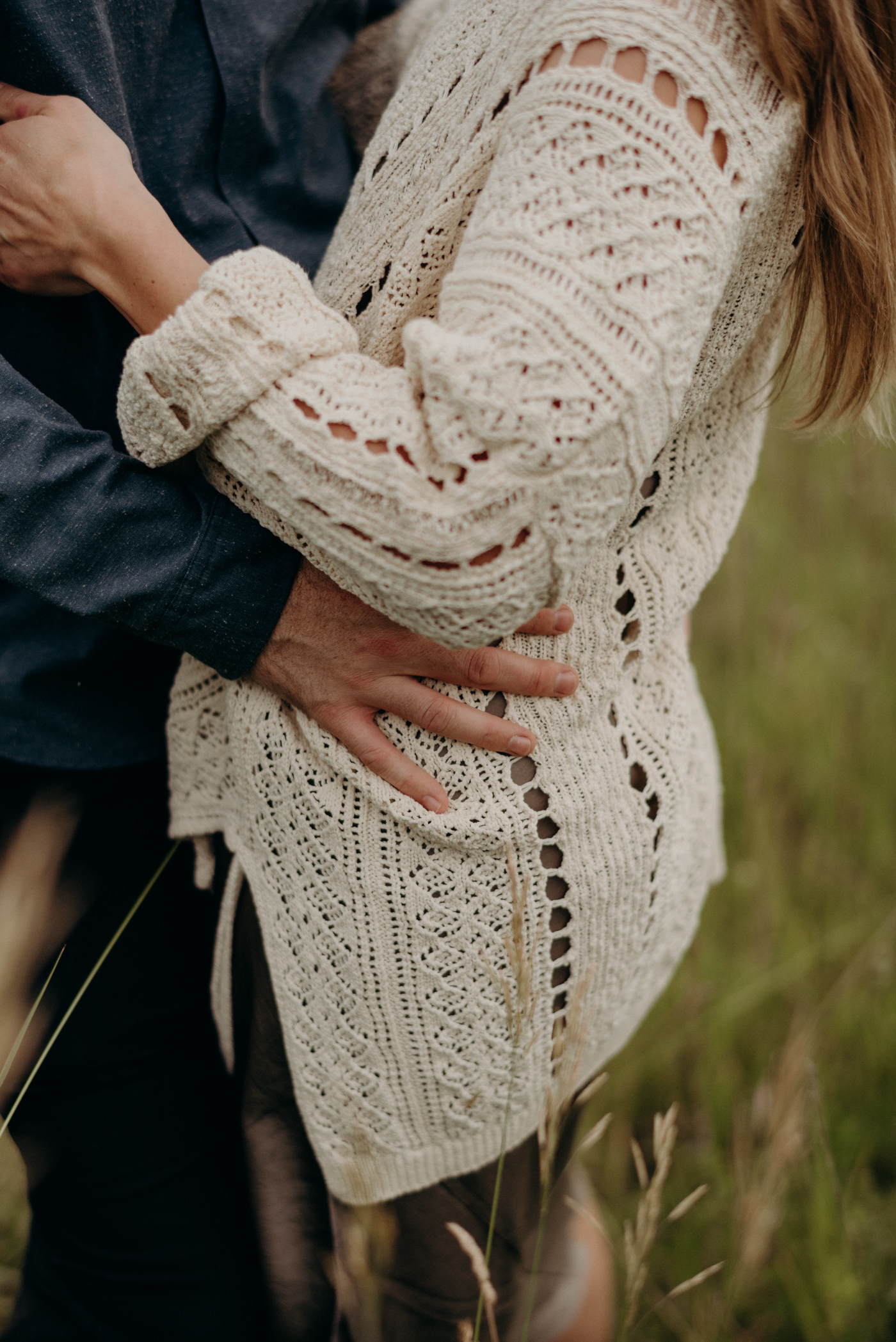 guy hugging girl in vintage sweater