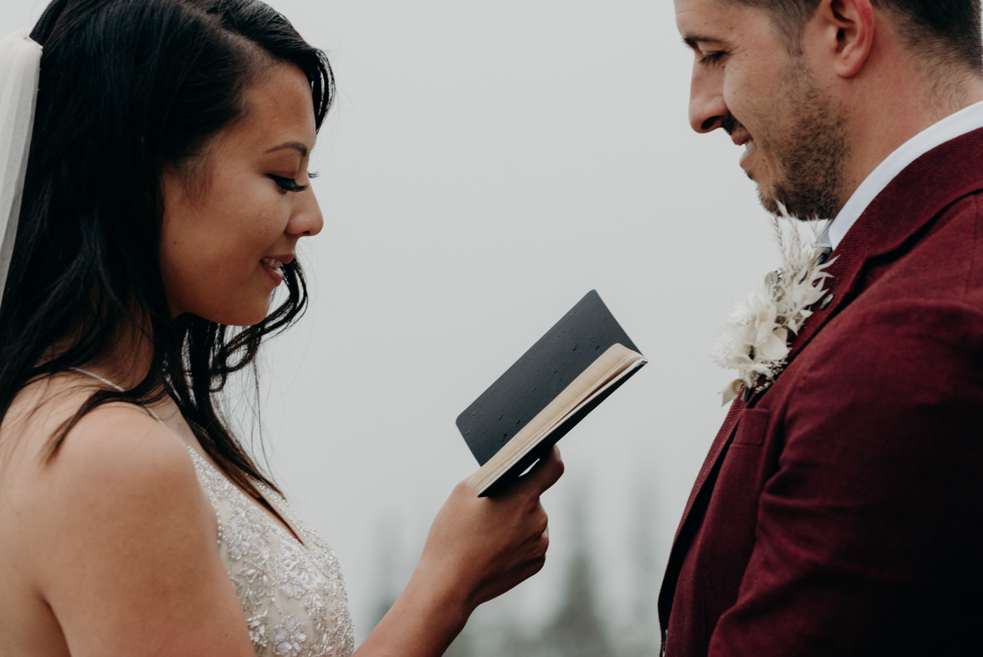 bride reading vows to groom, banff national park elopement