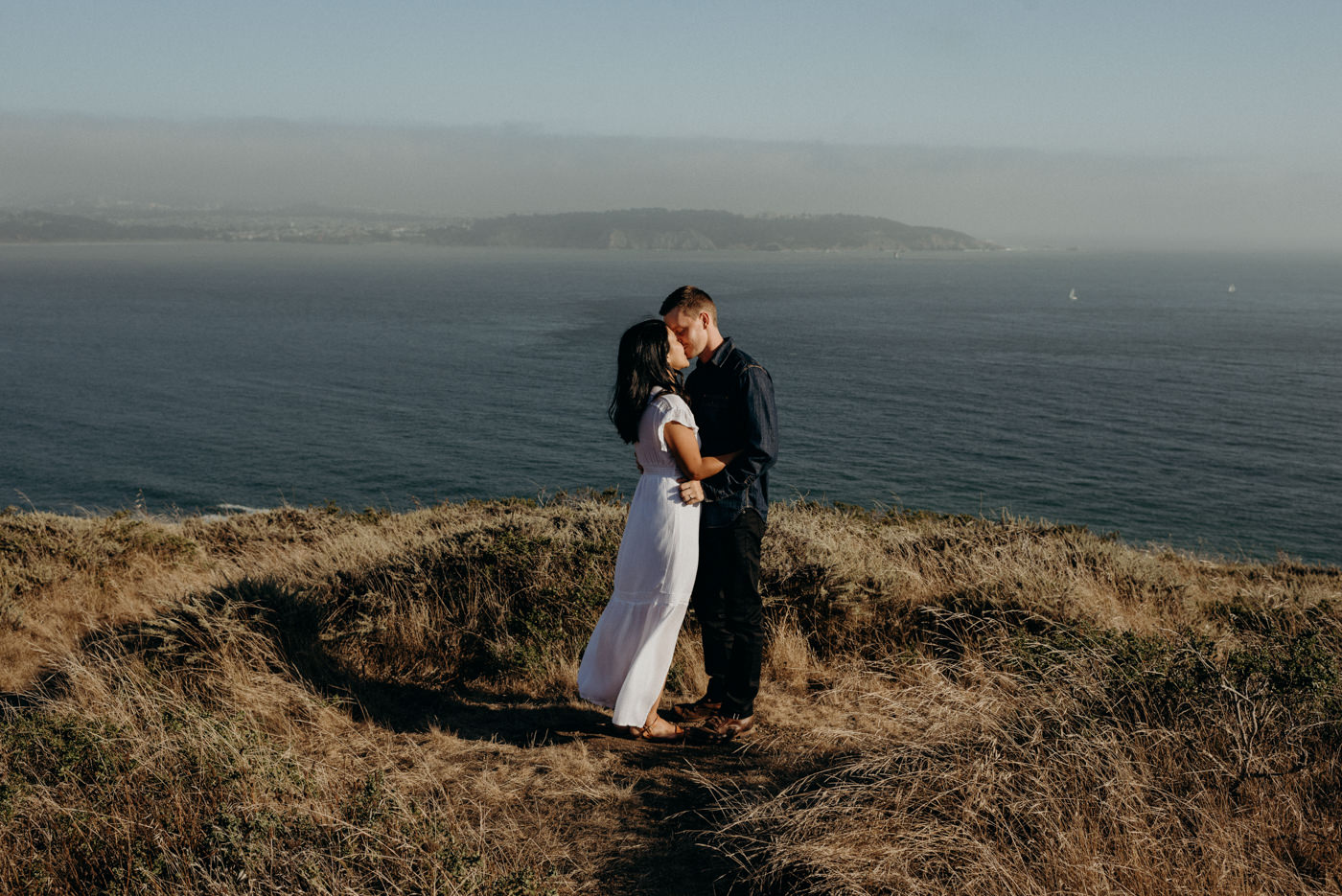 couple kissing at sunset at Marin Headlands Couple Shoot