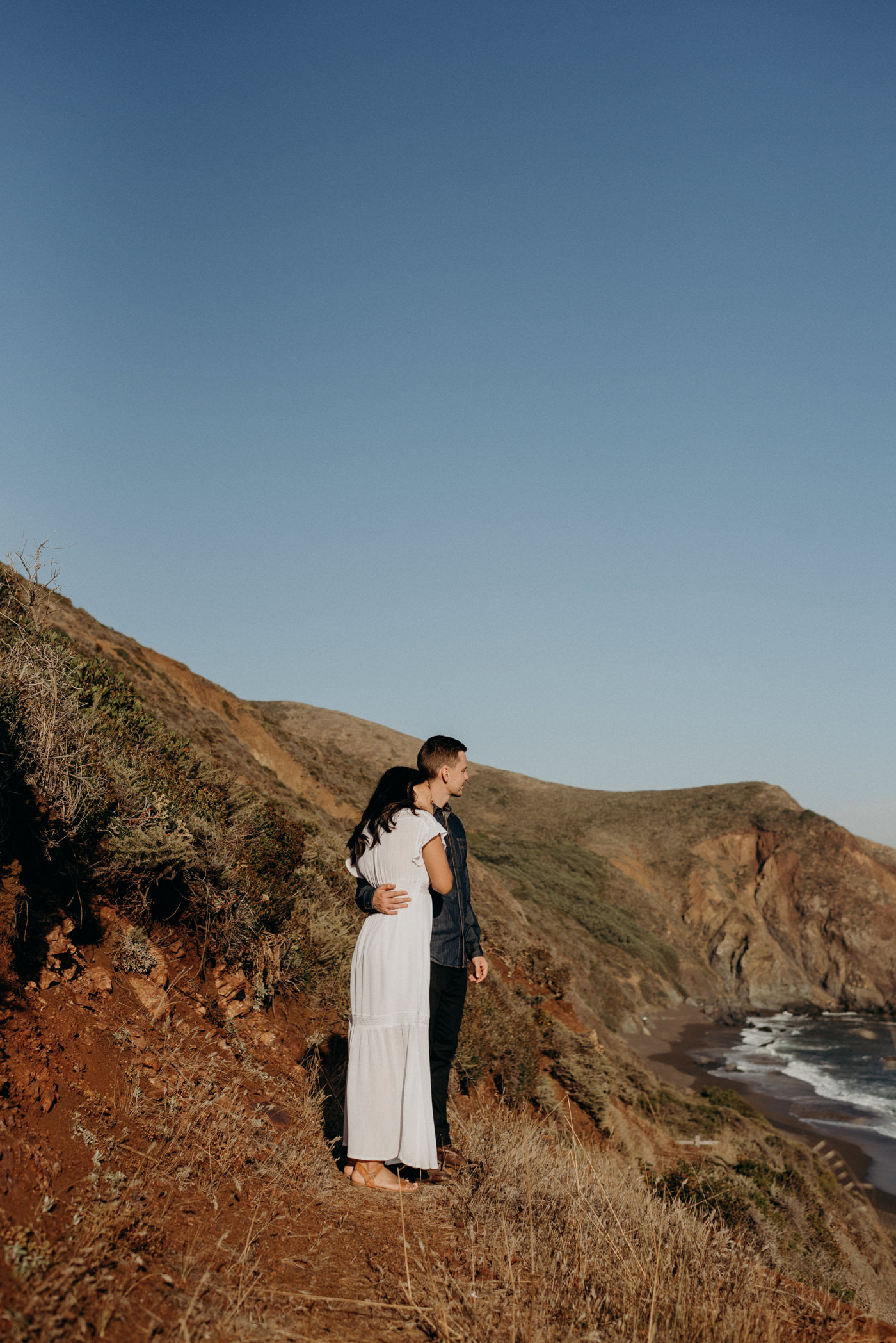 Couple looking off to ocean