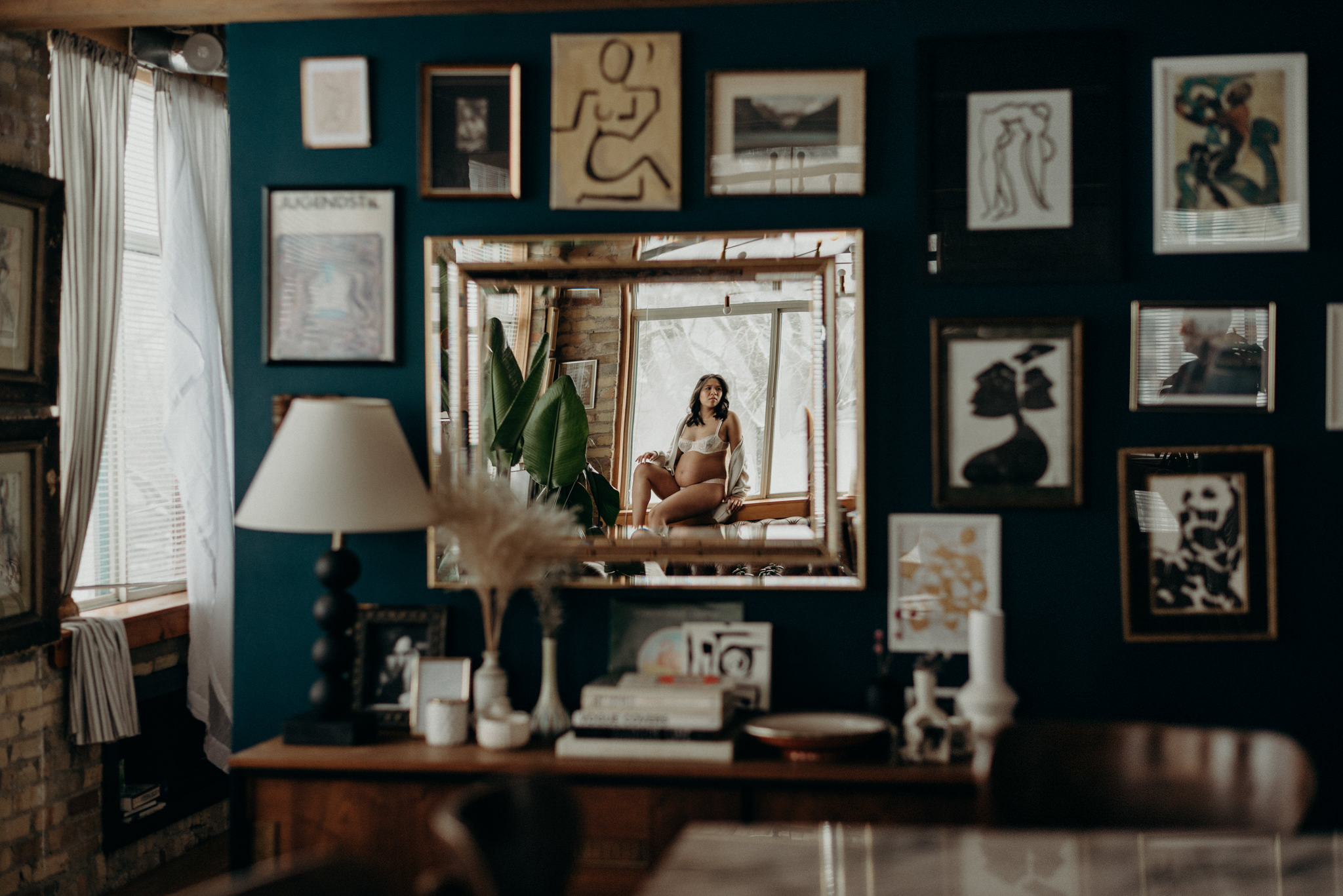 reflection of a pregnant woman in a loft