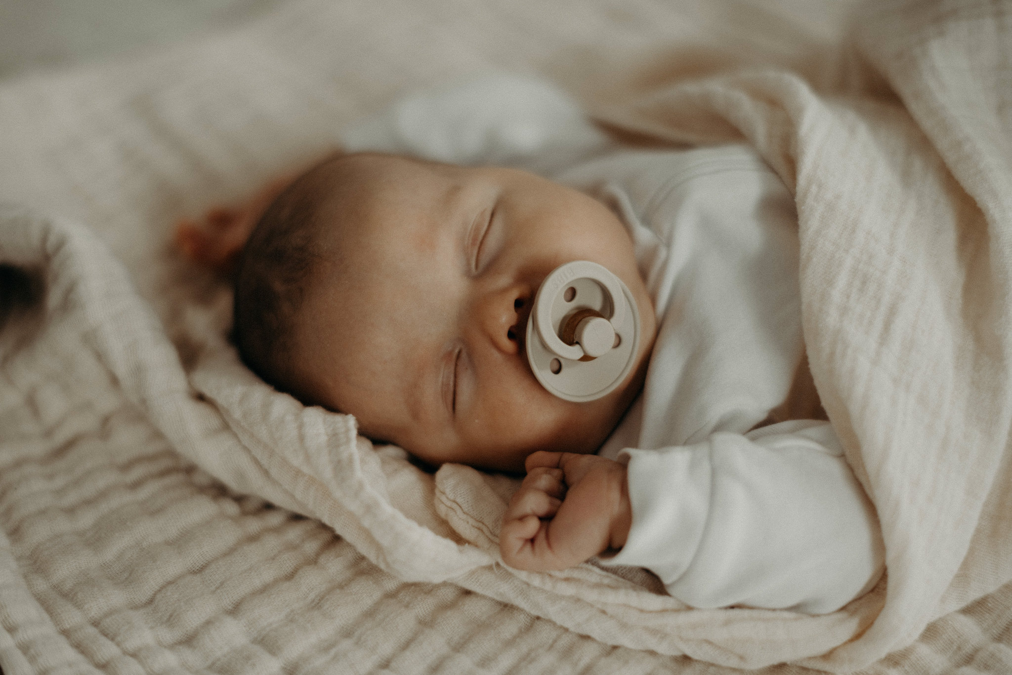 baby sleeping with bibs pacifier