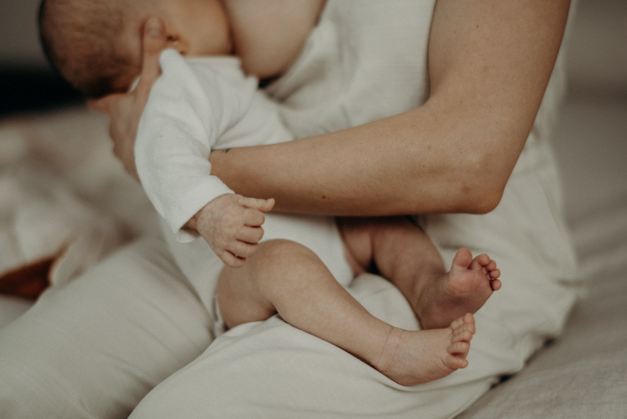 mother breastfeeding her infant son