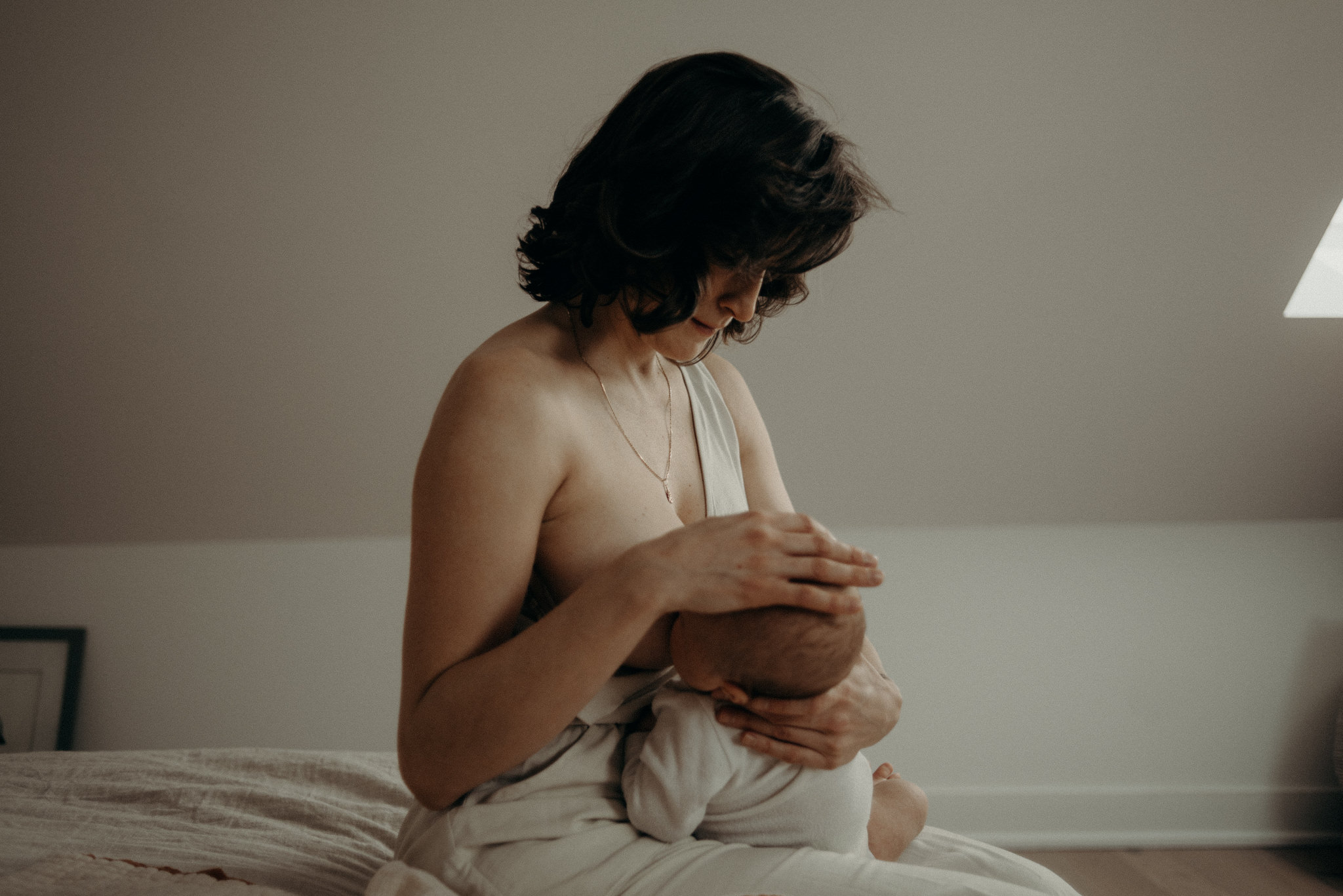 mother breastfeeding newborn baby