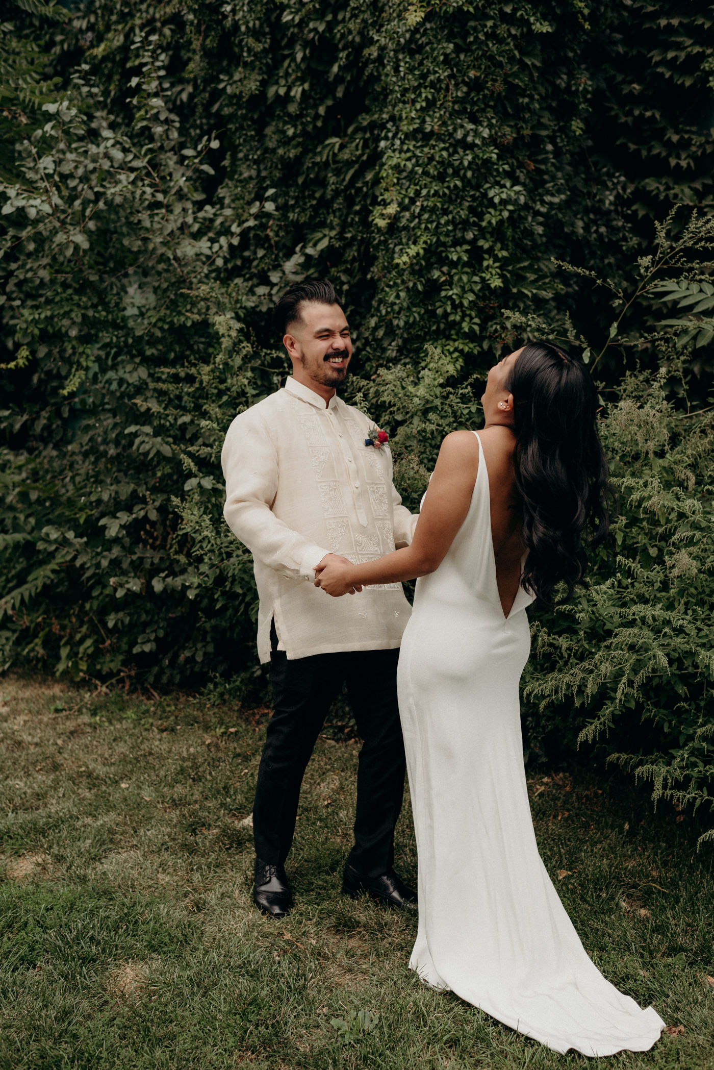 Bride and groom laughing during portraits at Distillery District