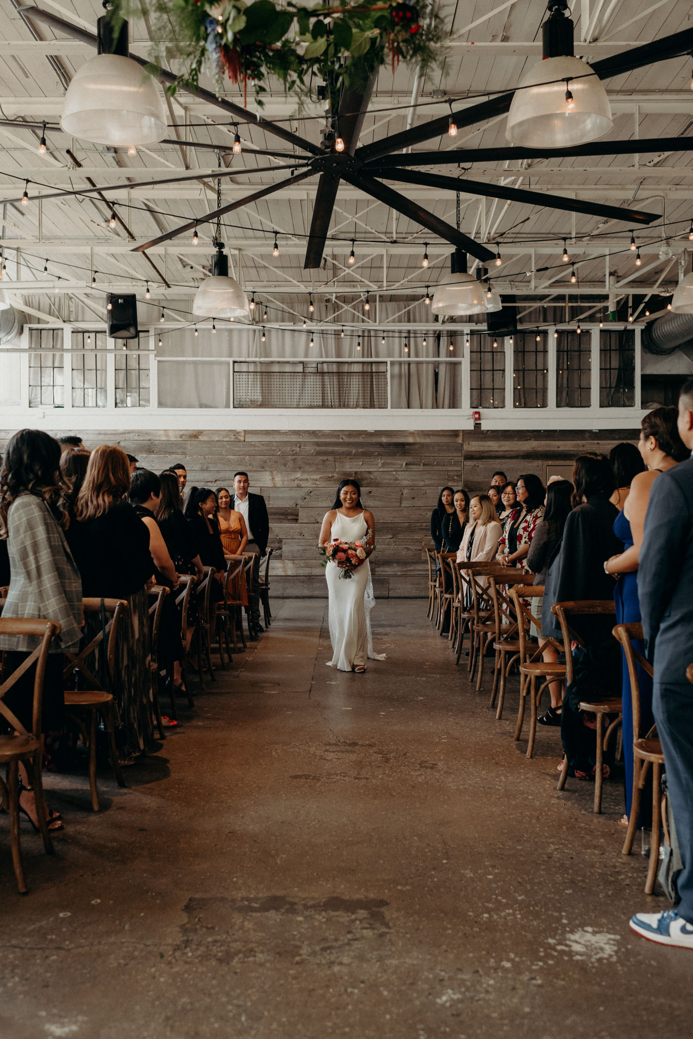 Bride walking down the aisle alone at Airship37 Wedding