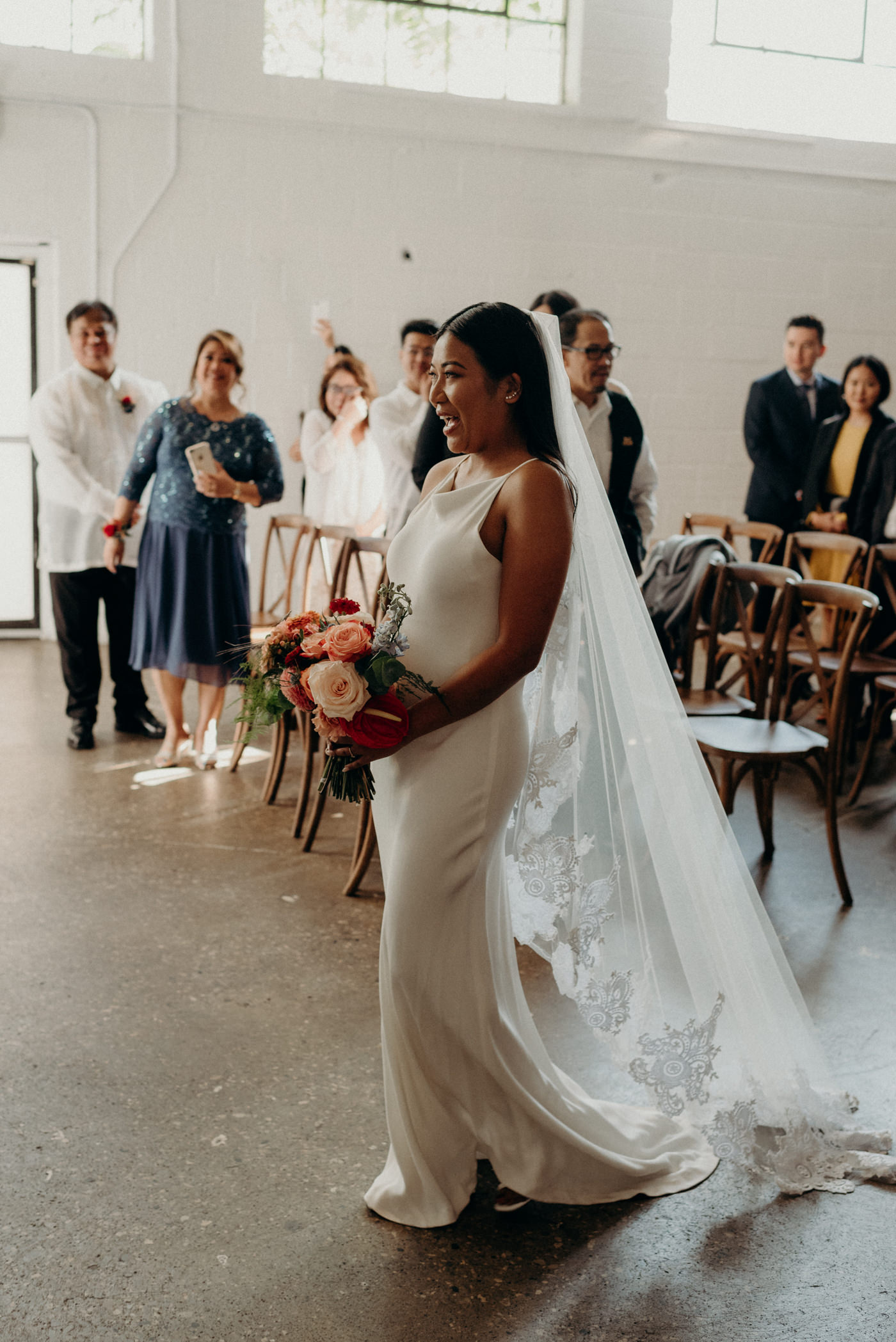 Bride walking down the aisle alone at Airship37 Wedding