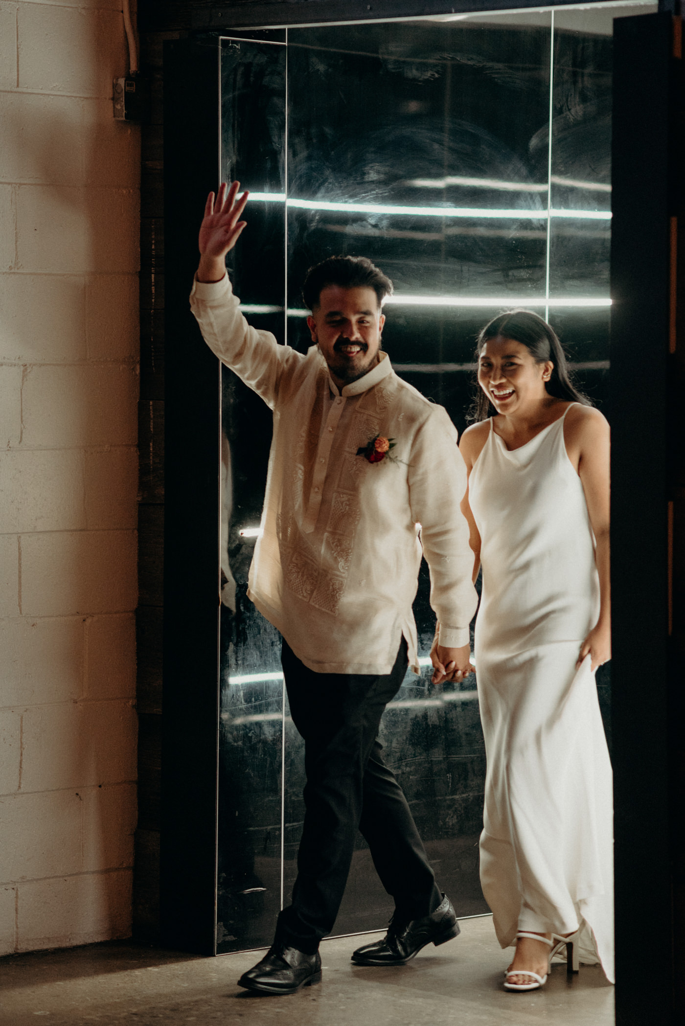 bride and groom entrance into wedding reception at Airship37