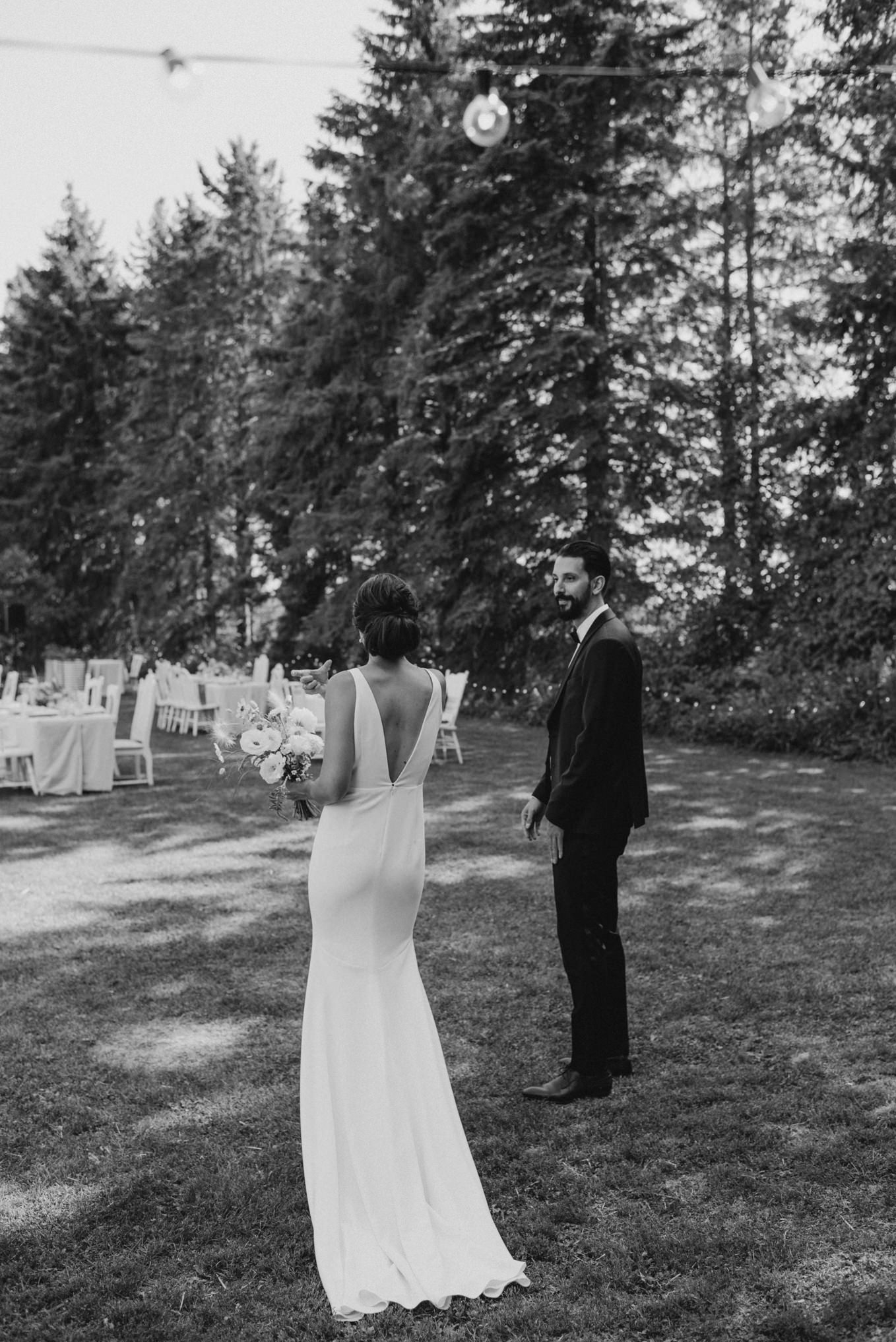 black and white photos of bride and groom on grass beside tables for outdoor wedding reception