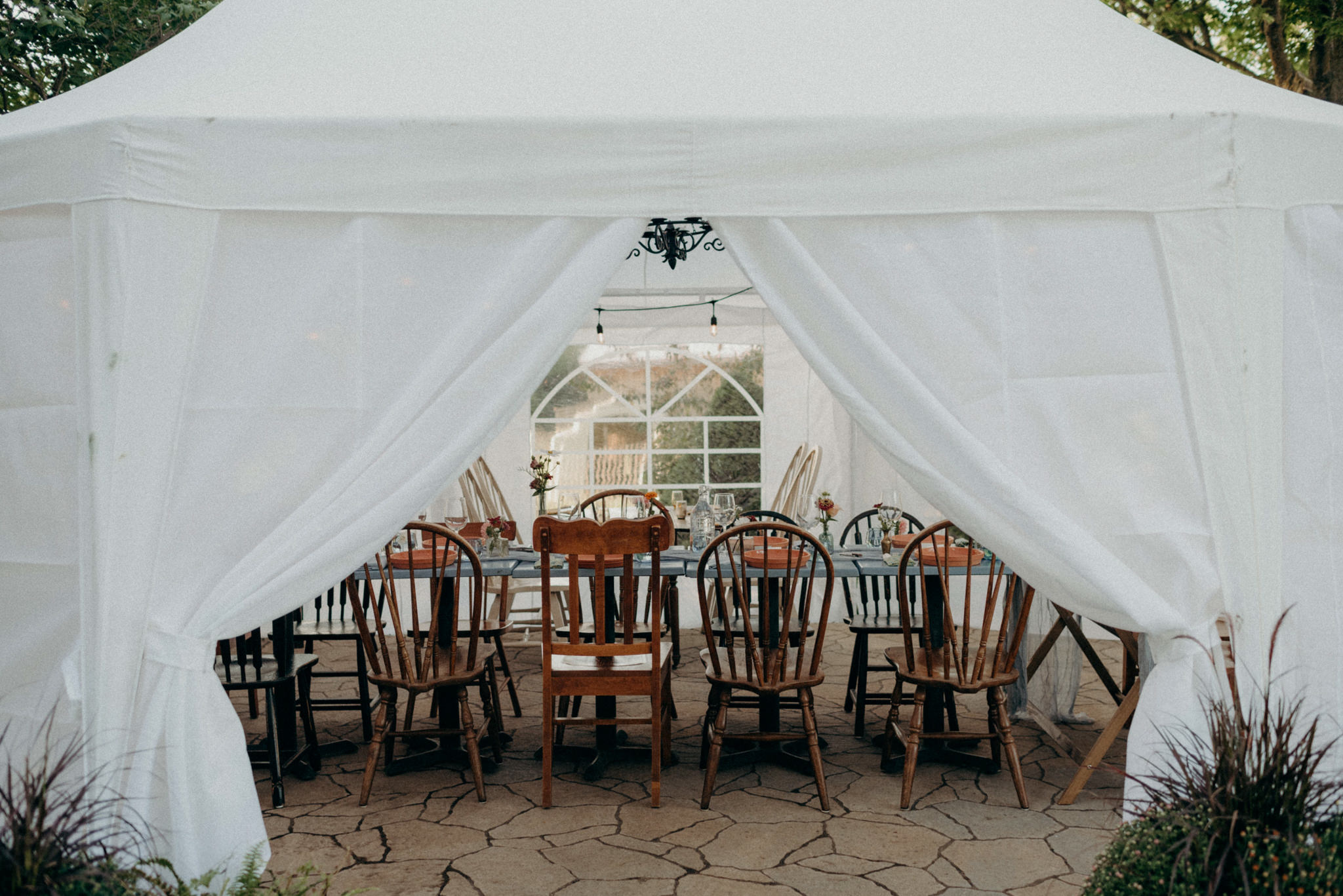 white tent intimate wedding reception dinner set up