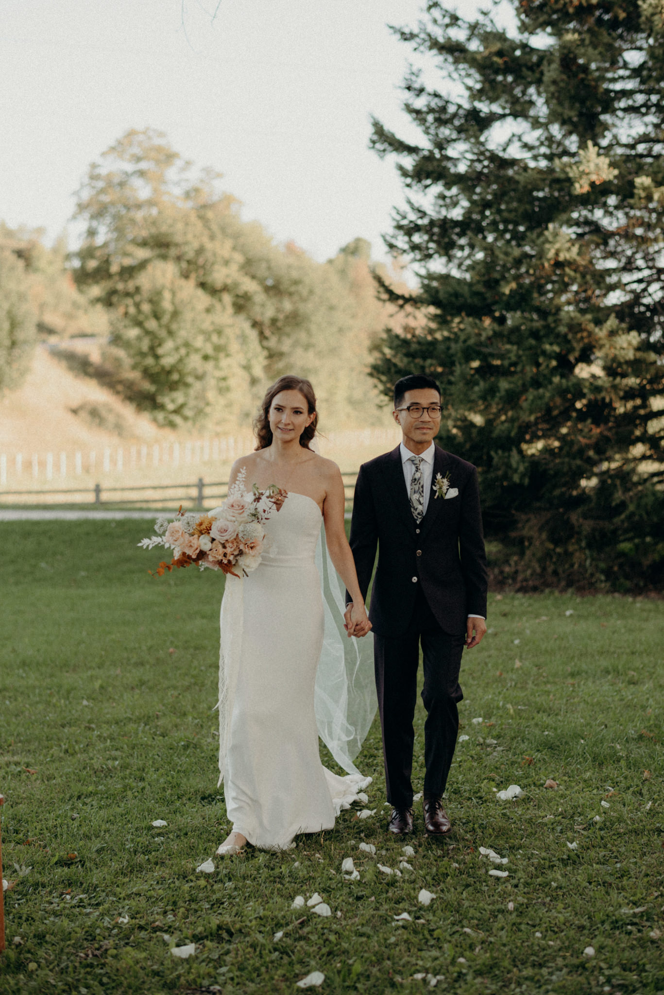 bride and groom walking down aisle together