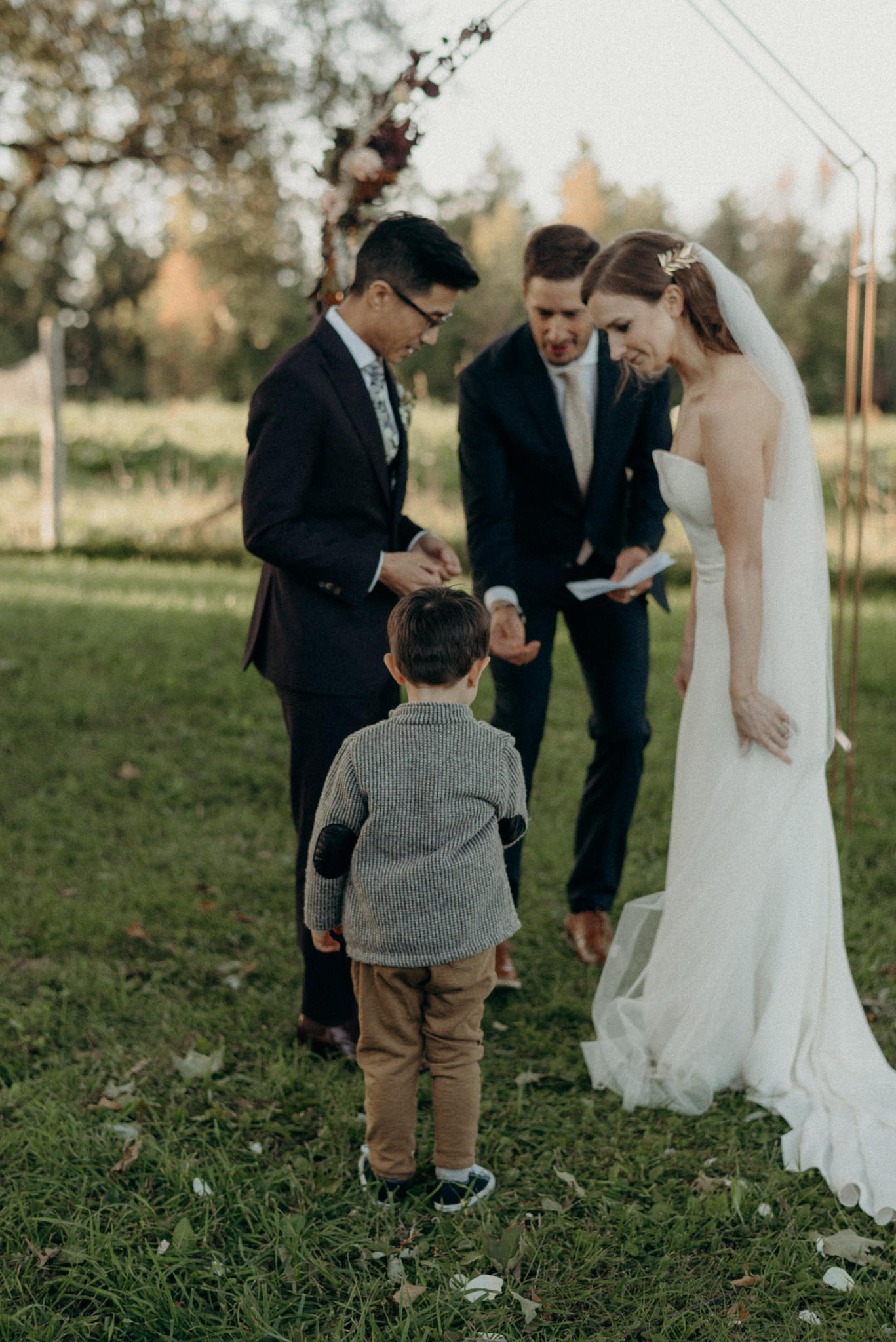 ring bearer bringing rings to couple during ceremony