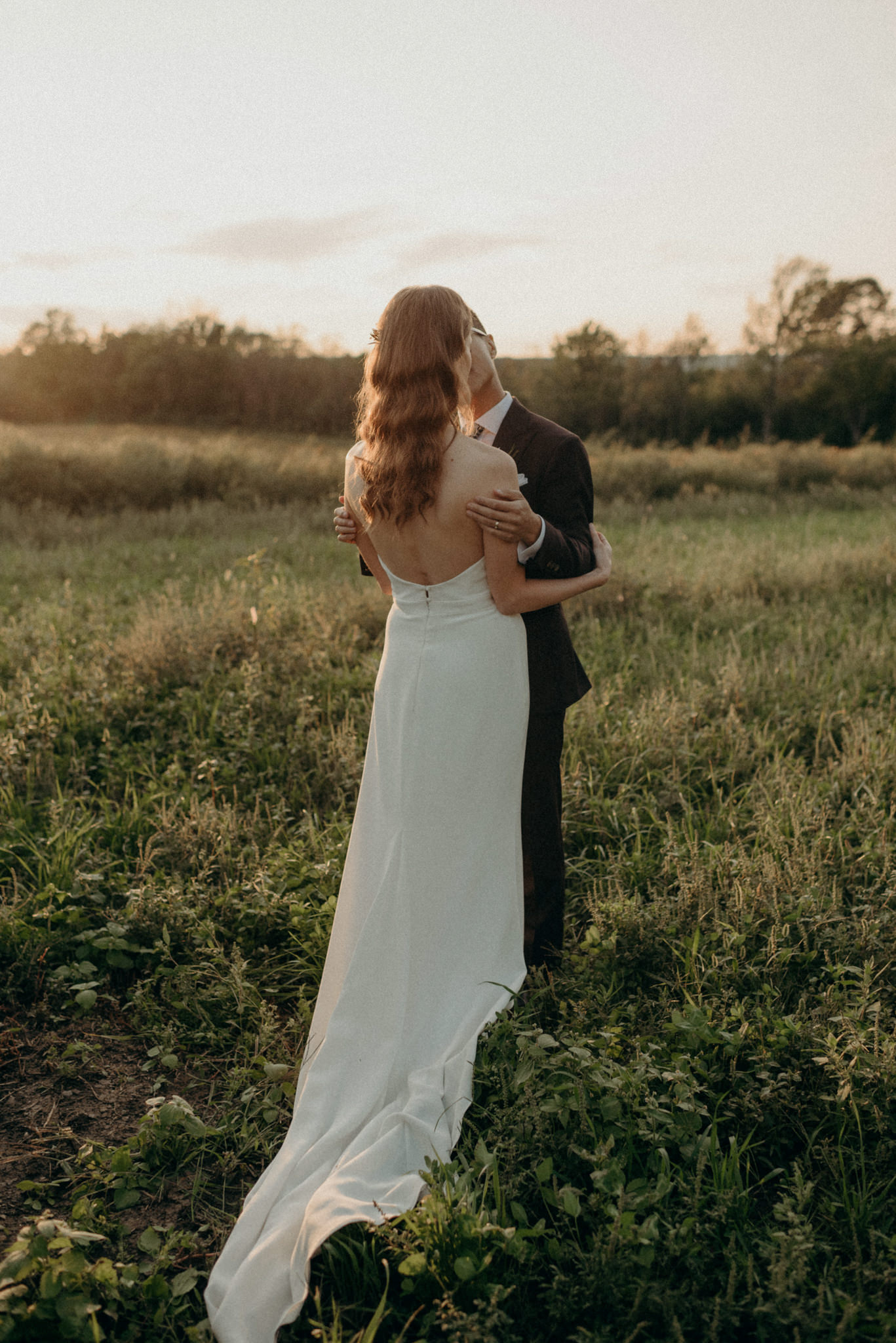 Wedding portraits in a field at sunset. Good Family Farms wedding.