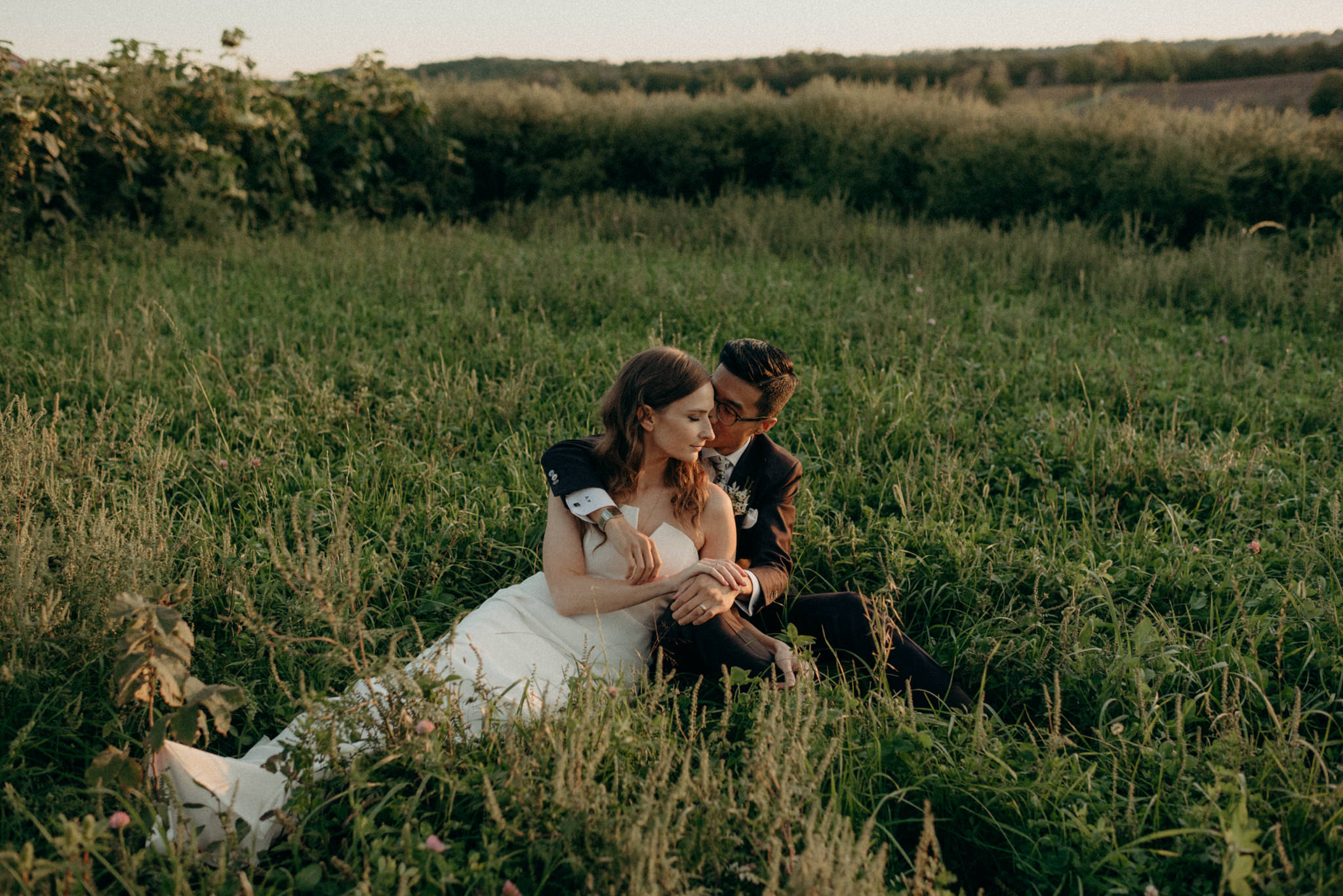 Wedding portraits in a field at sunset. Good Family Farms wedding.