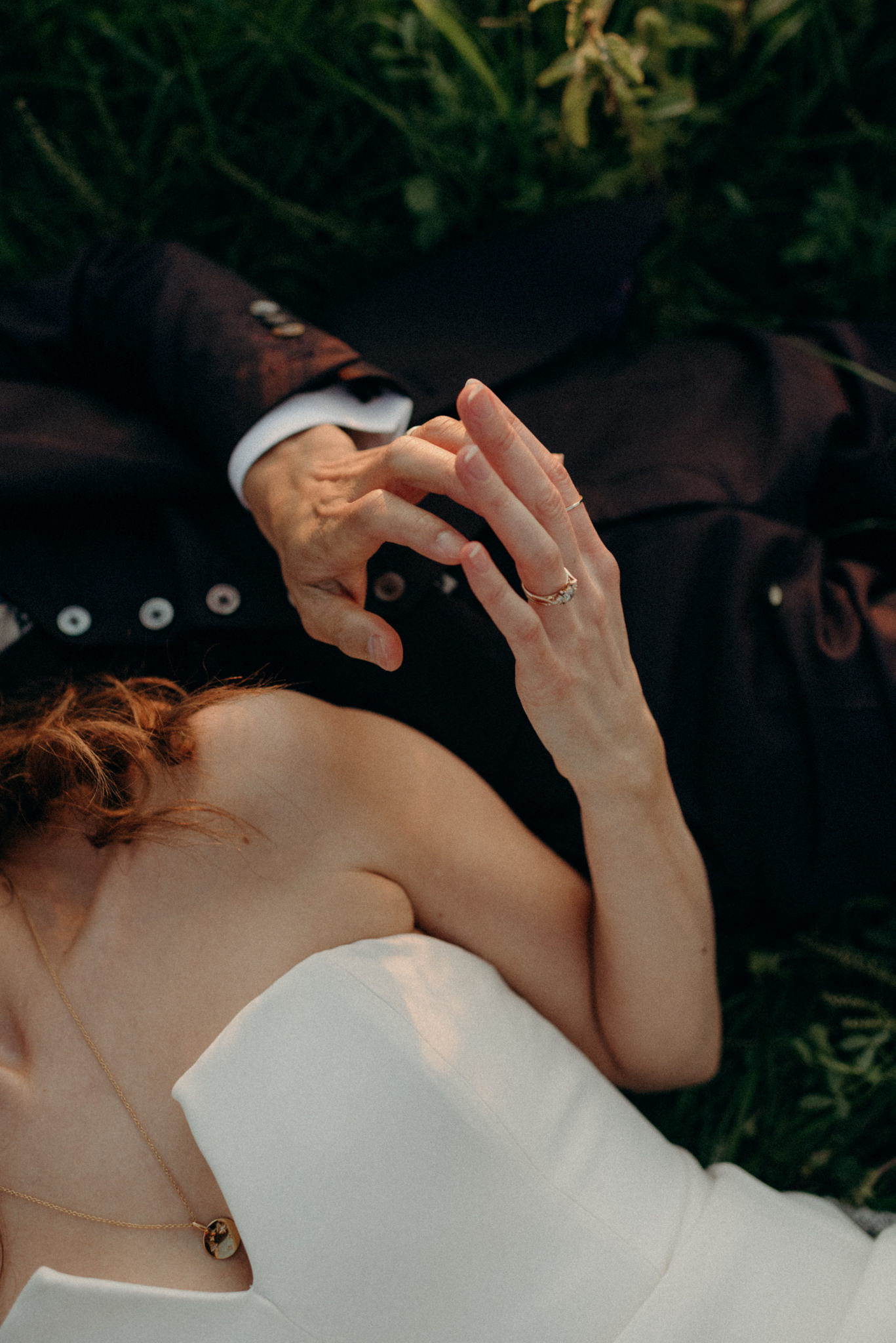 Wedding portraits lying in a field at sunset. Good Family Farms wedding.