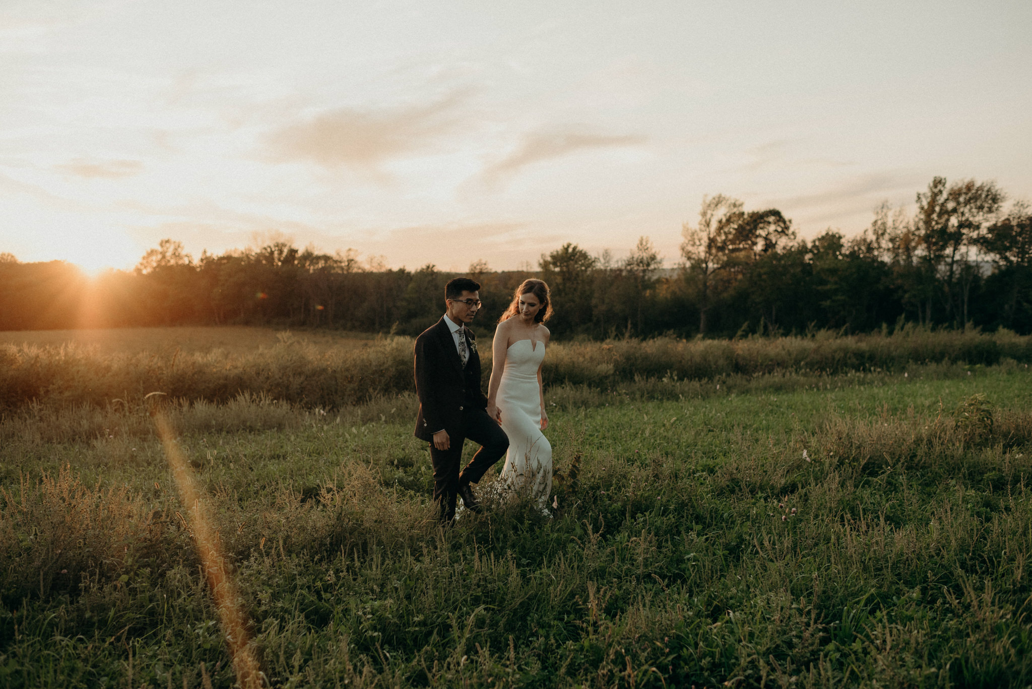 Wedding portraits in a field at sunset. Good Family Farms wedding.