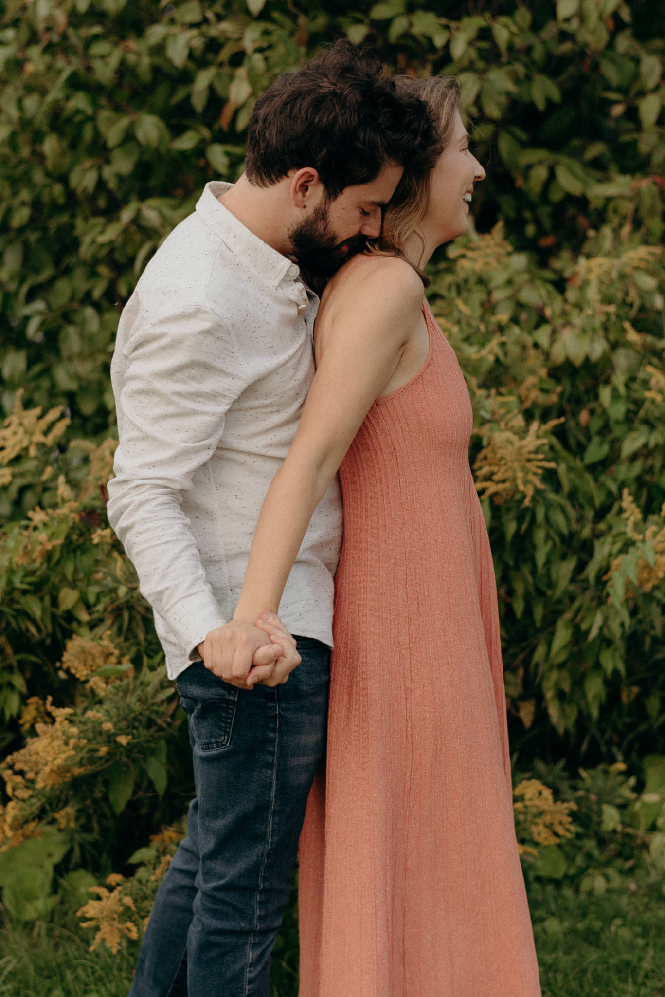 guy kissing girls shoulder