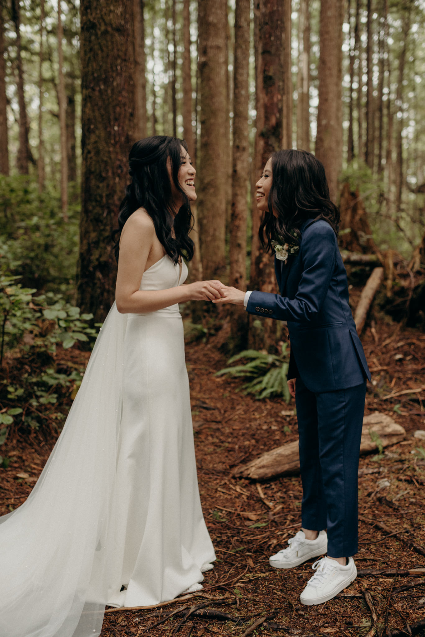 brides laughing in forest, same sex elopement