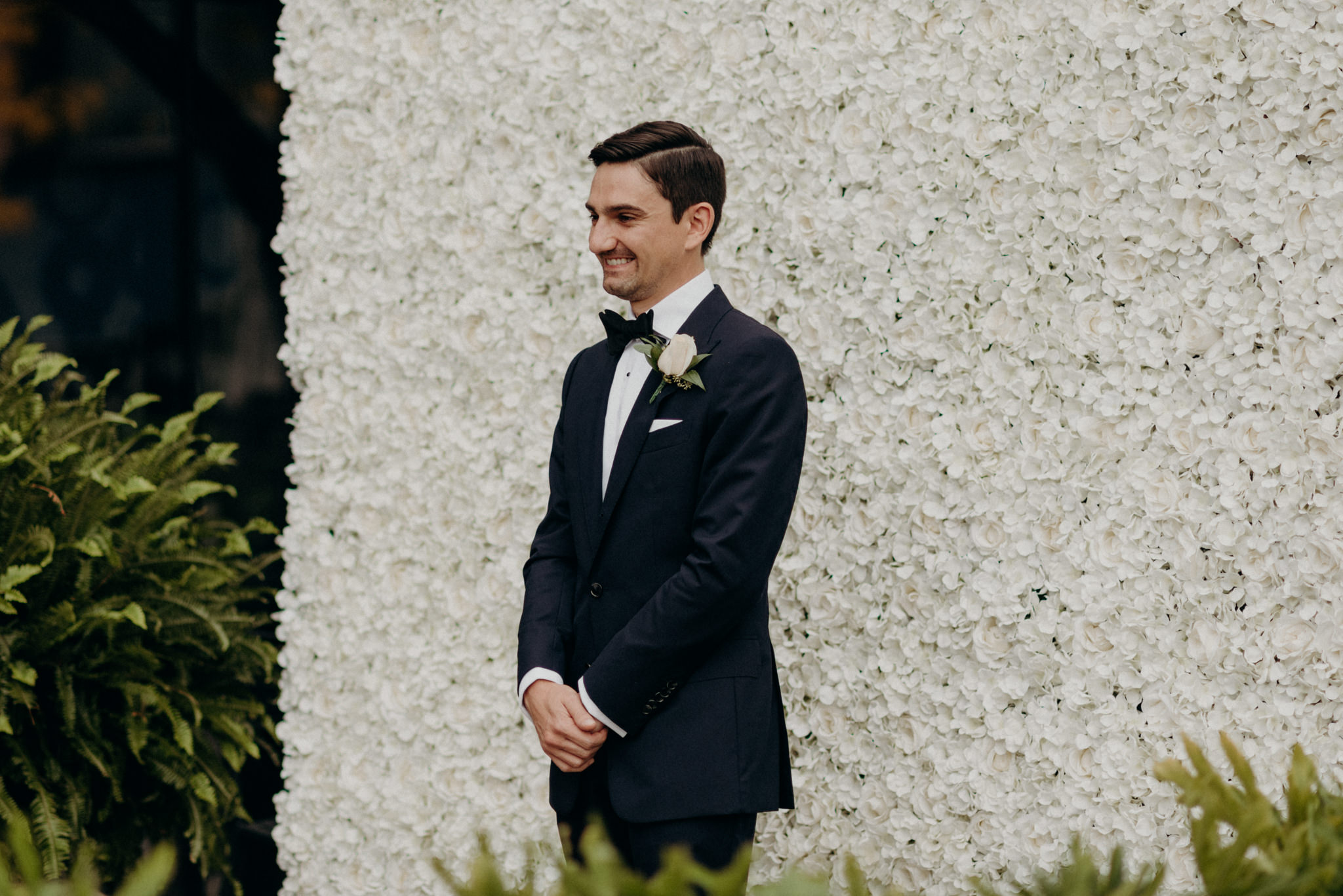 groom waiting for first look