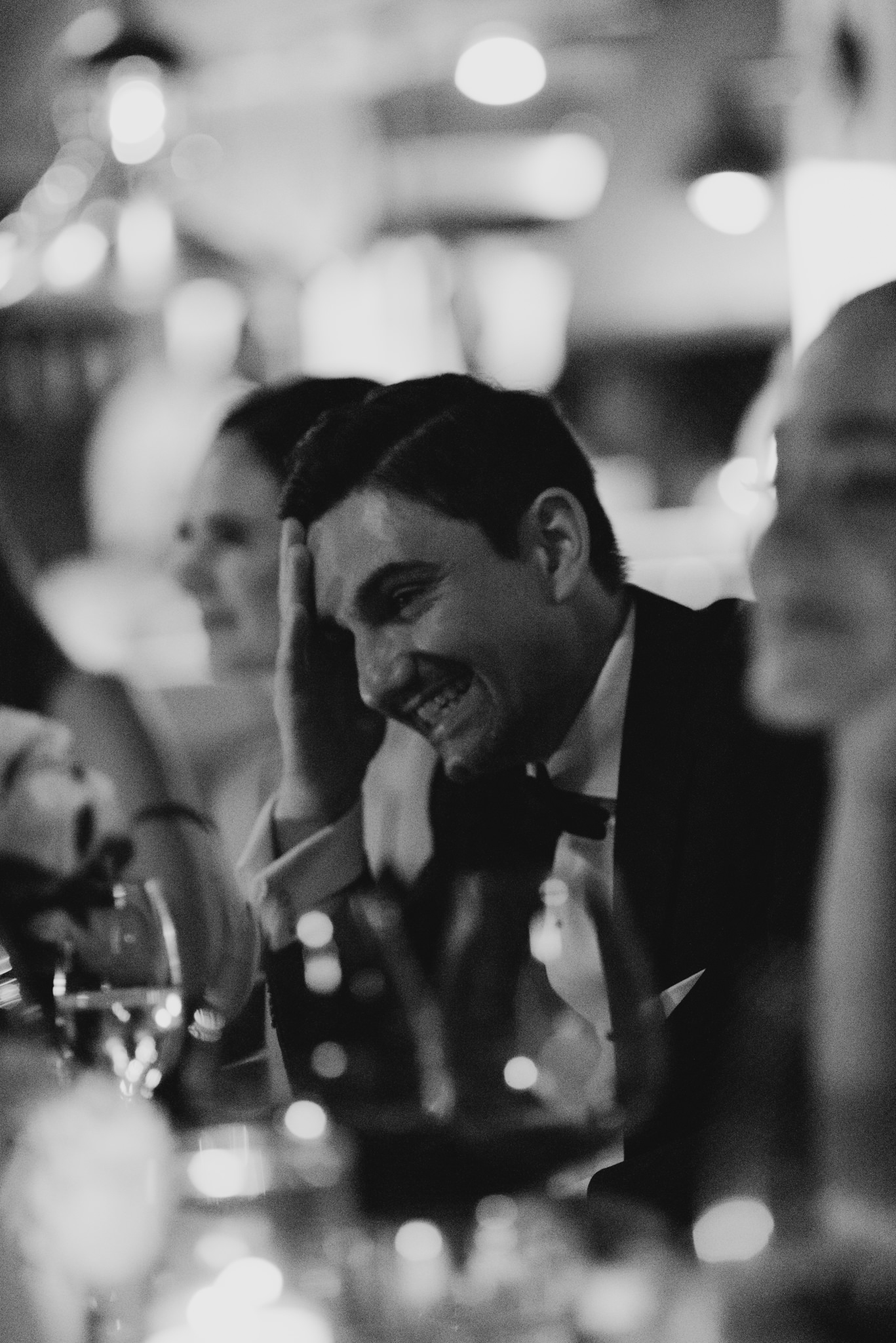 groom laughing during speeches